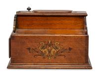 A Monitor Paint Decorated Oak and Cast Iron Coin-Operated Barbershop Cash Register