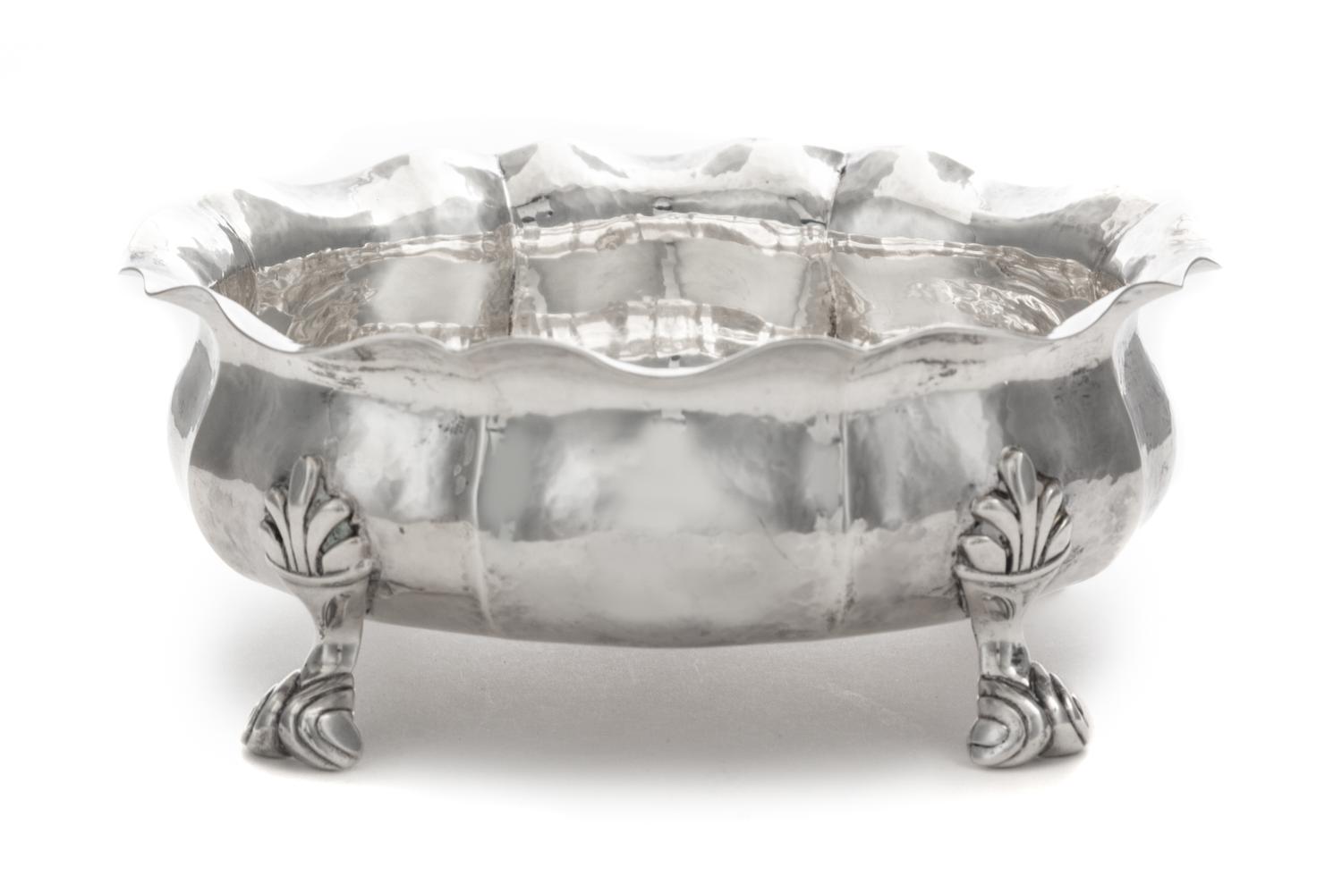 An Italian Silver Bowl, Buccellati, 20th Century, having a flared rim and an undulating body and raised on four foliate scroll decorate