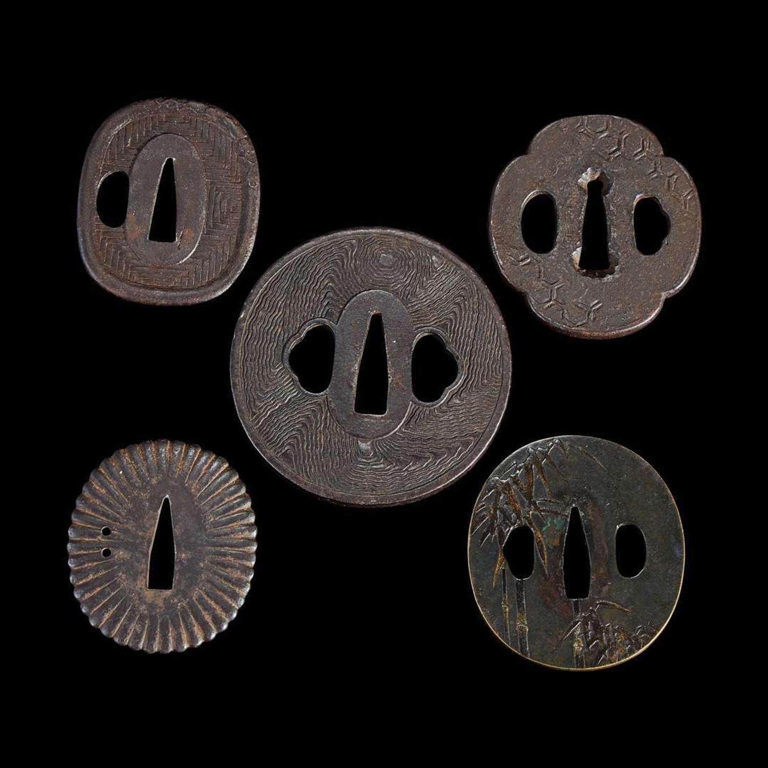 Group of fifteen assorted Japanese tsuba Meiji period and earlier