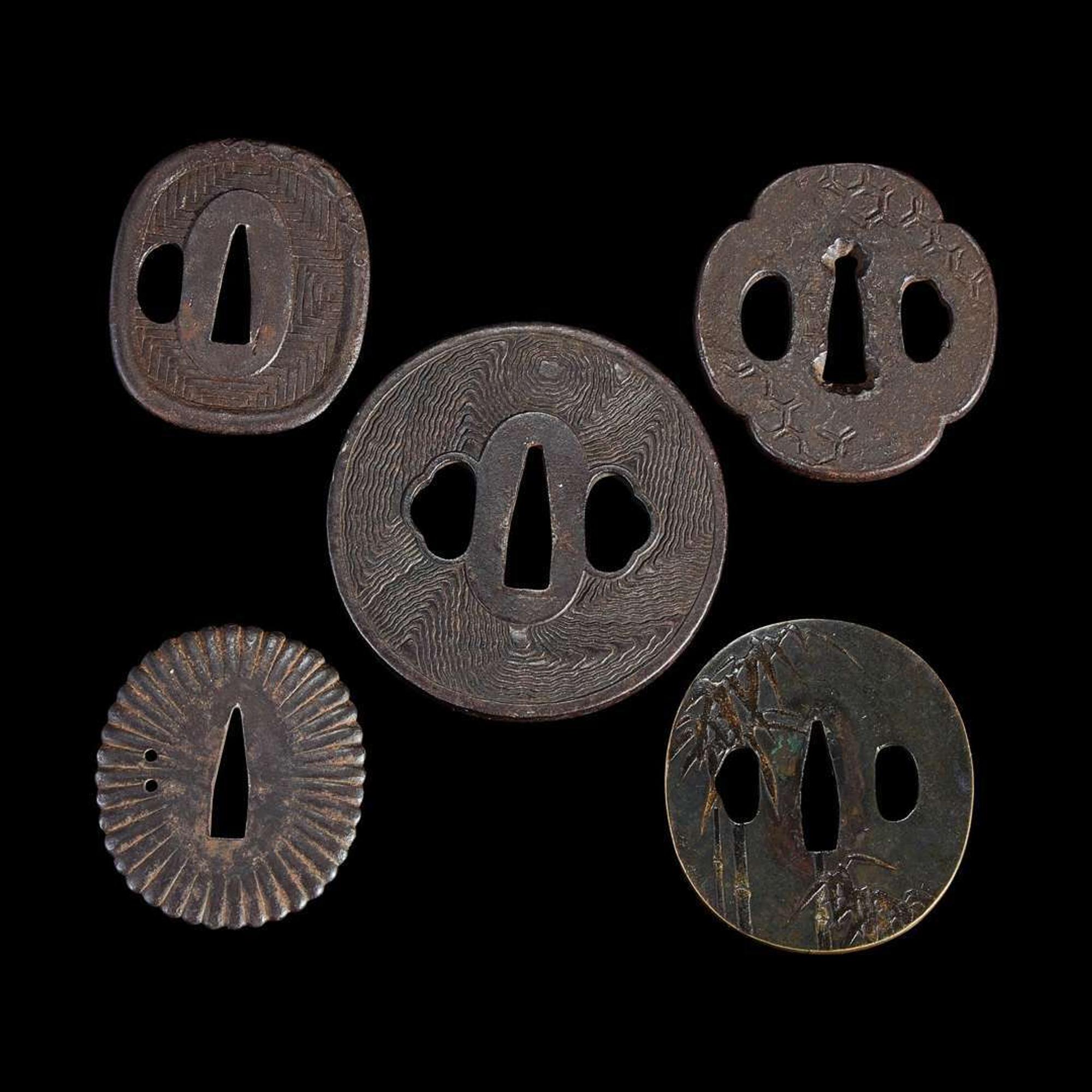 Group of fifteen assorted Japanese tsuba Meiji period and earlier