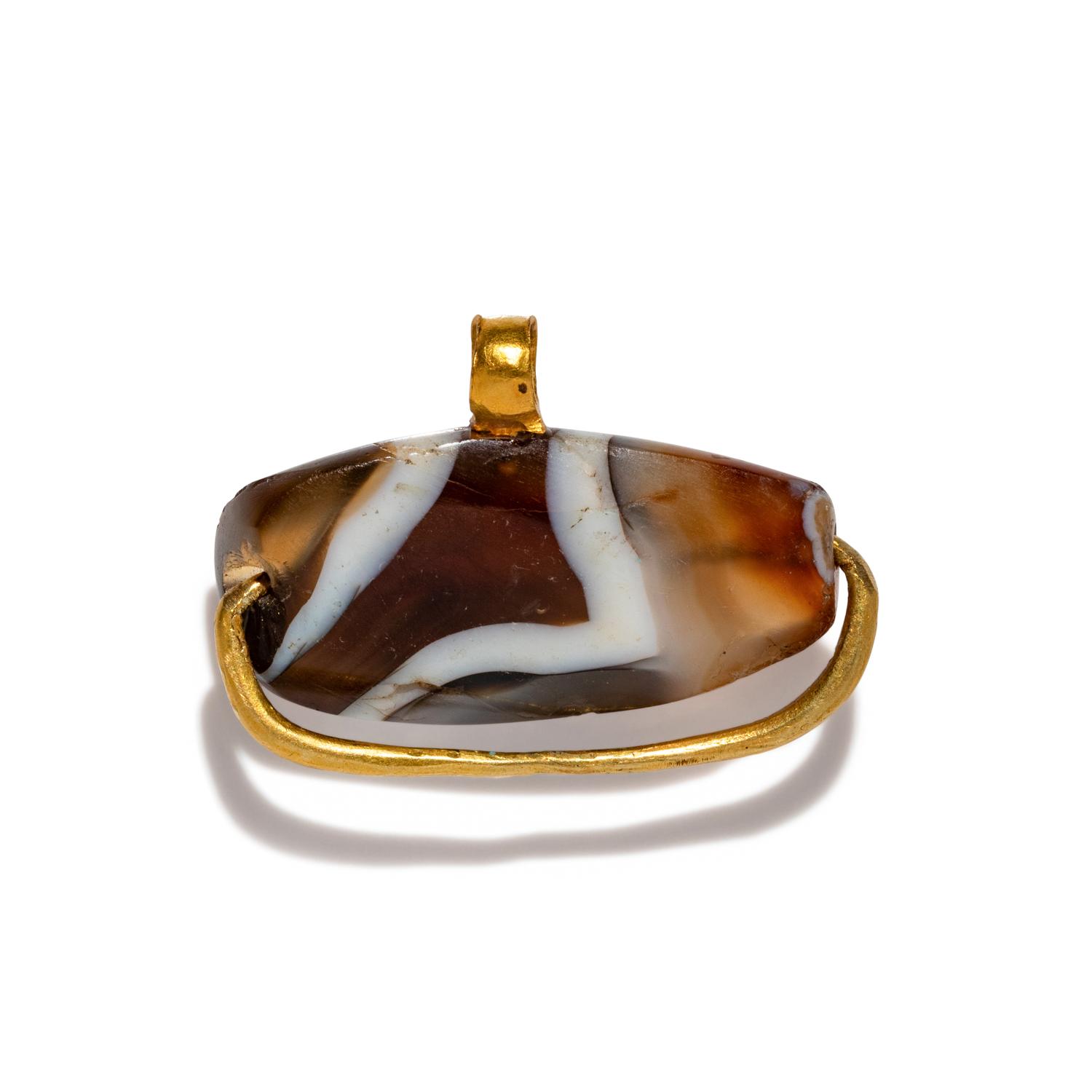 A Western Asiatic Gold and Agate Bead Pendant