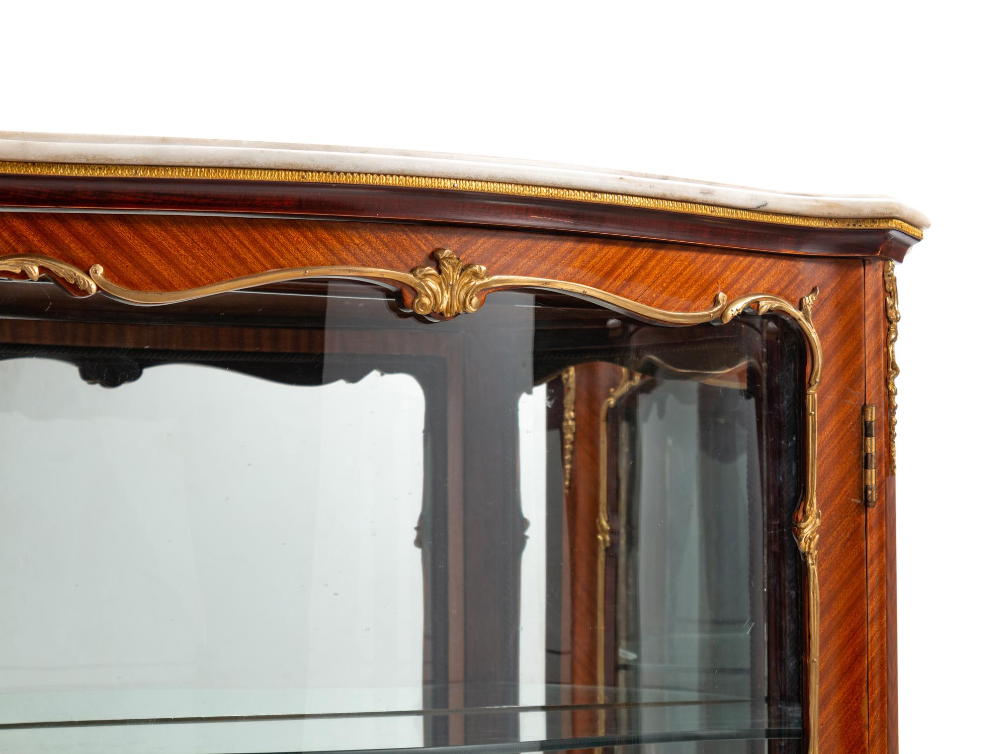 A Pair of Louis XV Style Gilt Metal Mounted Marble-Top Vitrine Cabinets