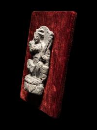 A Gandharan Schist Relief of a Musician