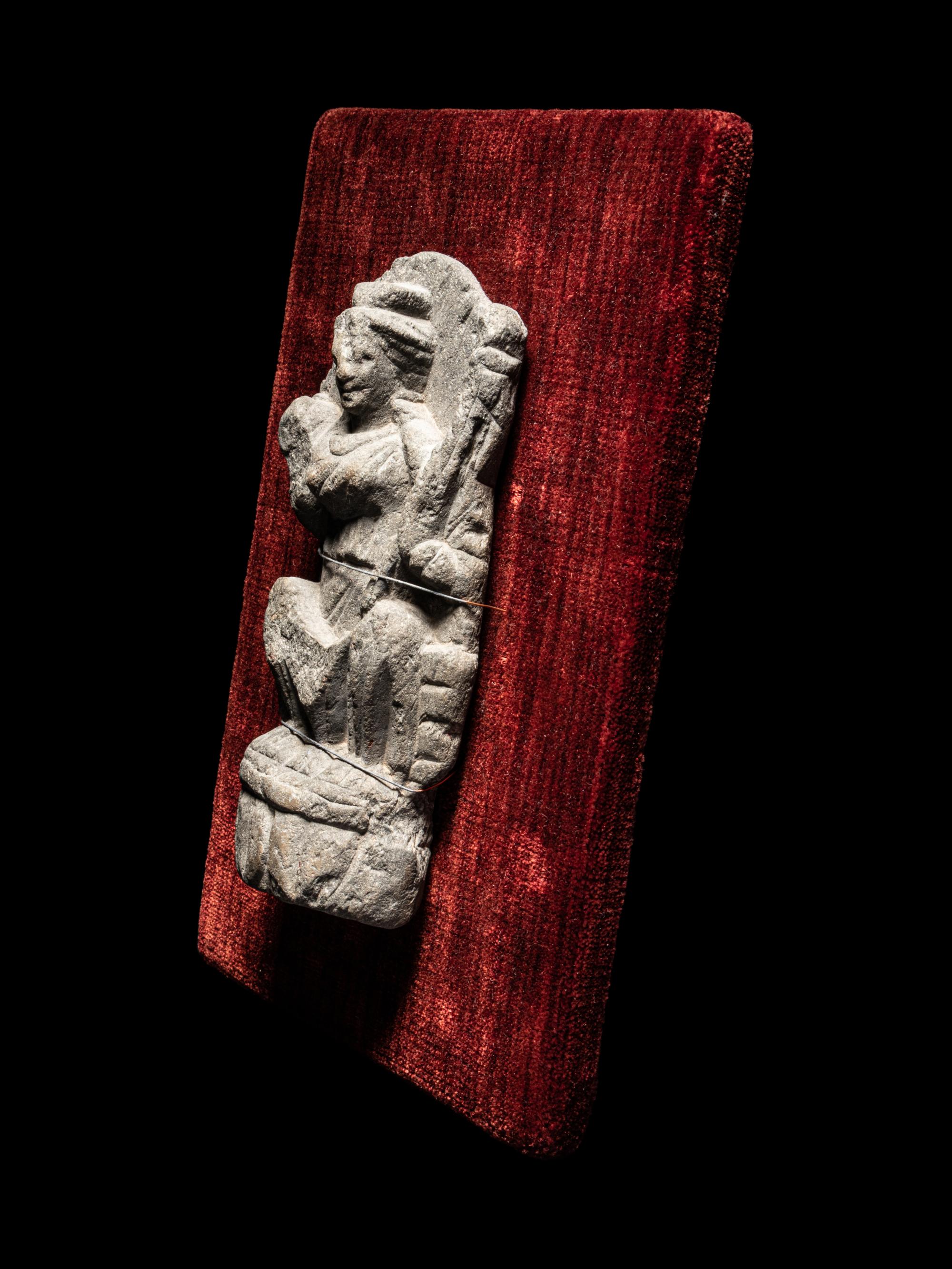 A Gandharan Schist Relief of a Musician