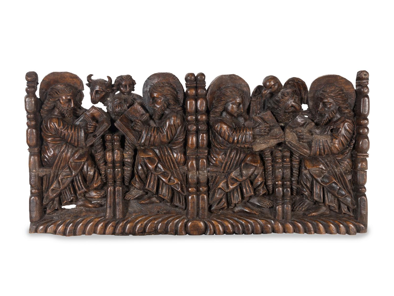 A Spanish Colonial Walnut Frieze Depicting the Four Evangelists