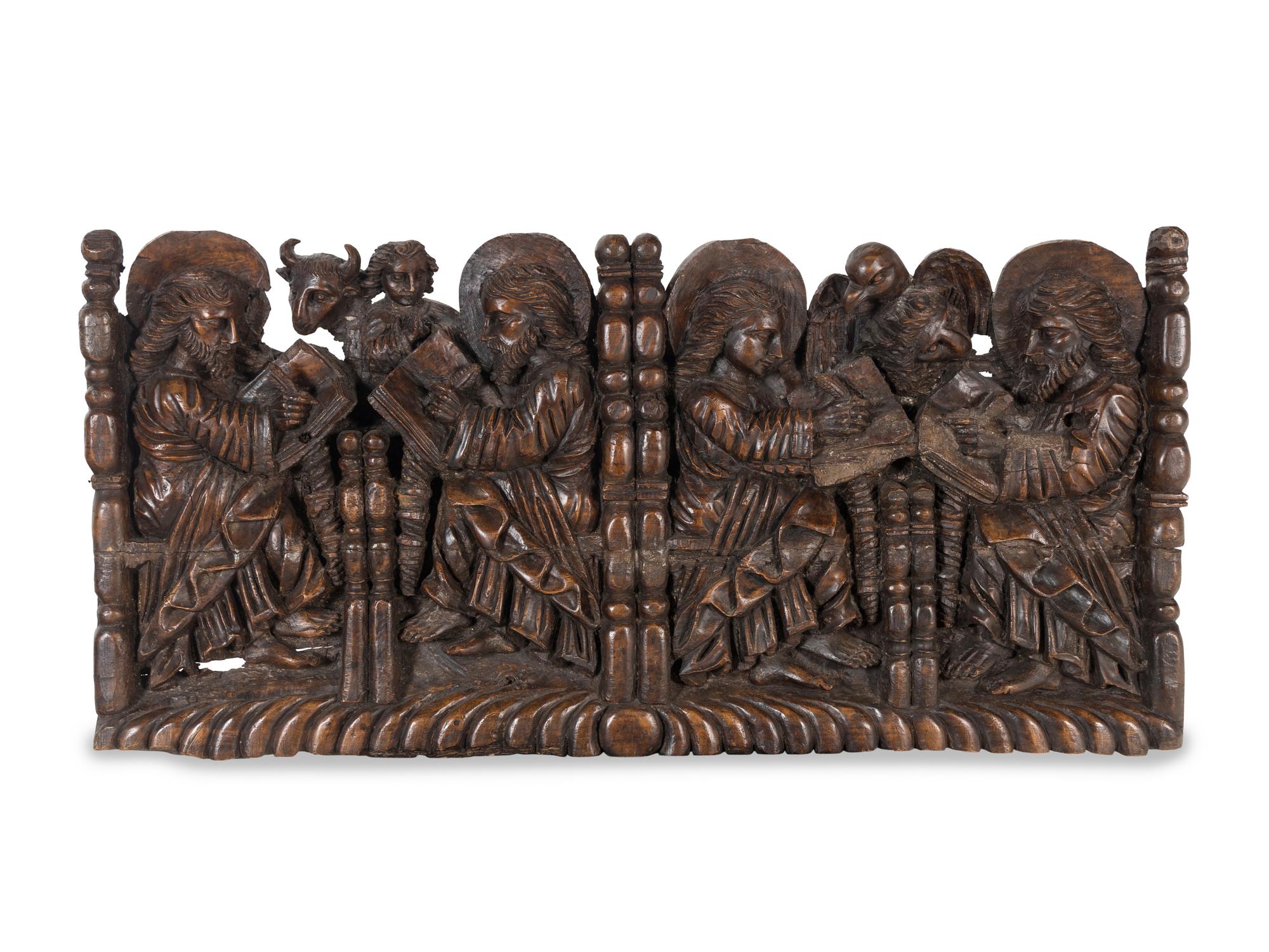 A Spanish Colonial Walnut Frieze Depicting the Four Evangelists