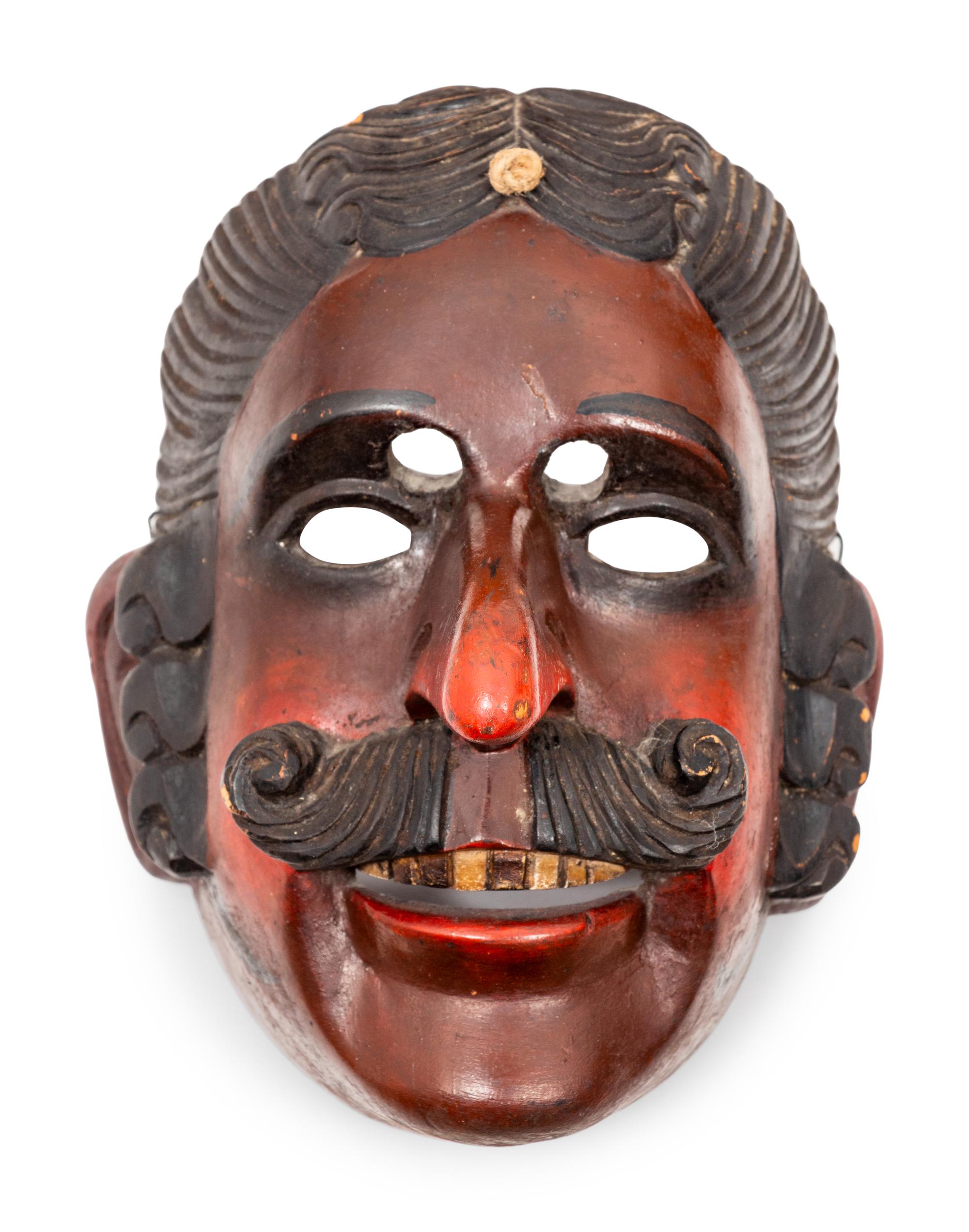 A Group of Continental Carved Wood Opera Masks