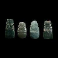 Four Costa Rican Jade Figural Celt Pendants