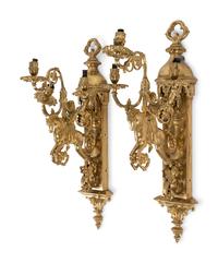 A Pair of Gothic Style Brass Three-Light Sconces