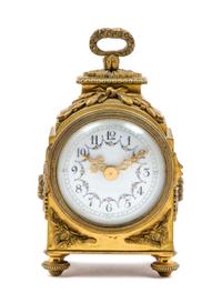 A French Gilt Bronze Carriage Clock Height 6 inches.