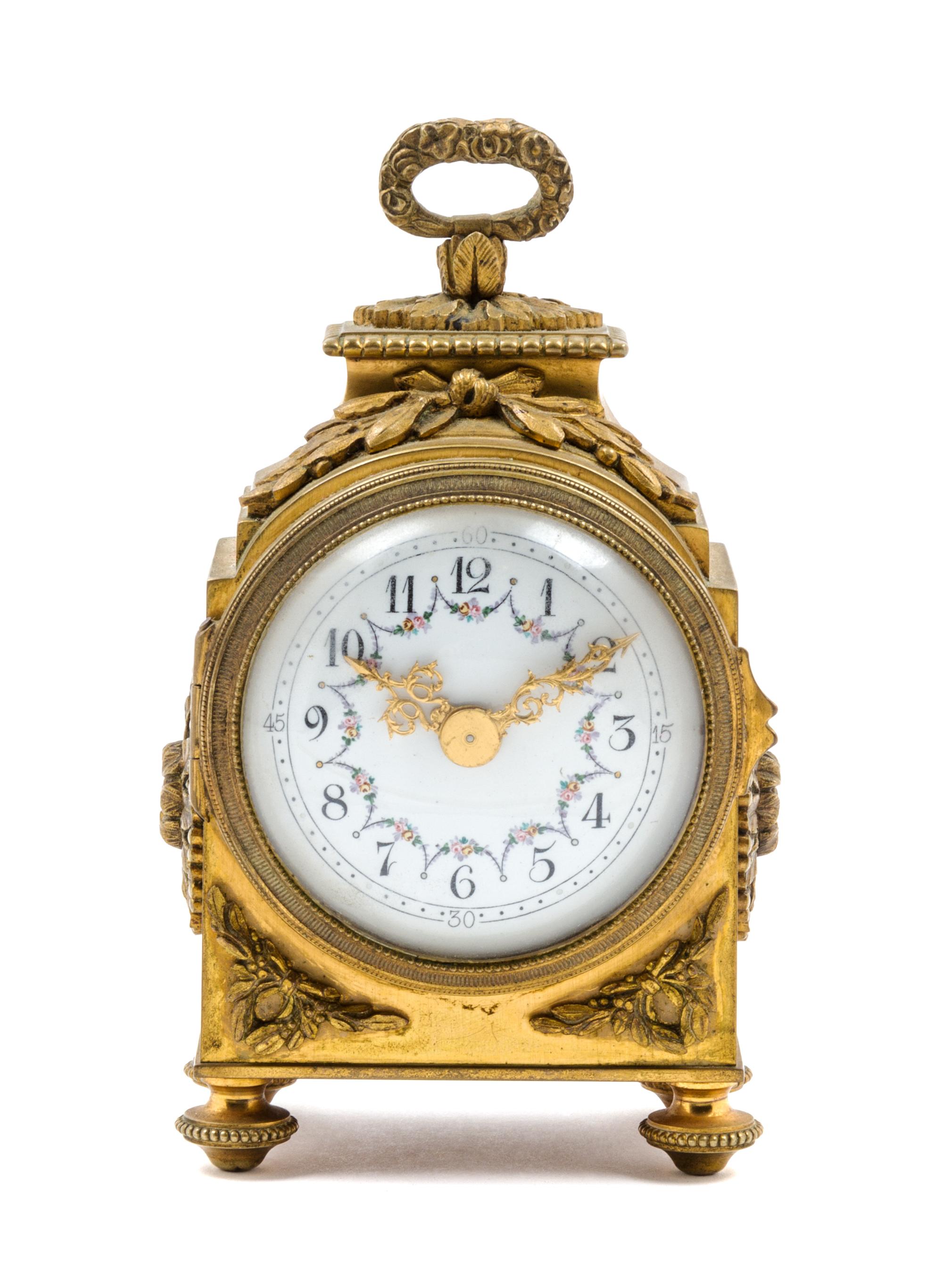 A French Gilt Bronze Carriage Clock Height 6 inches.