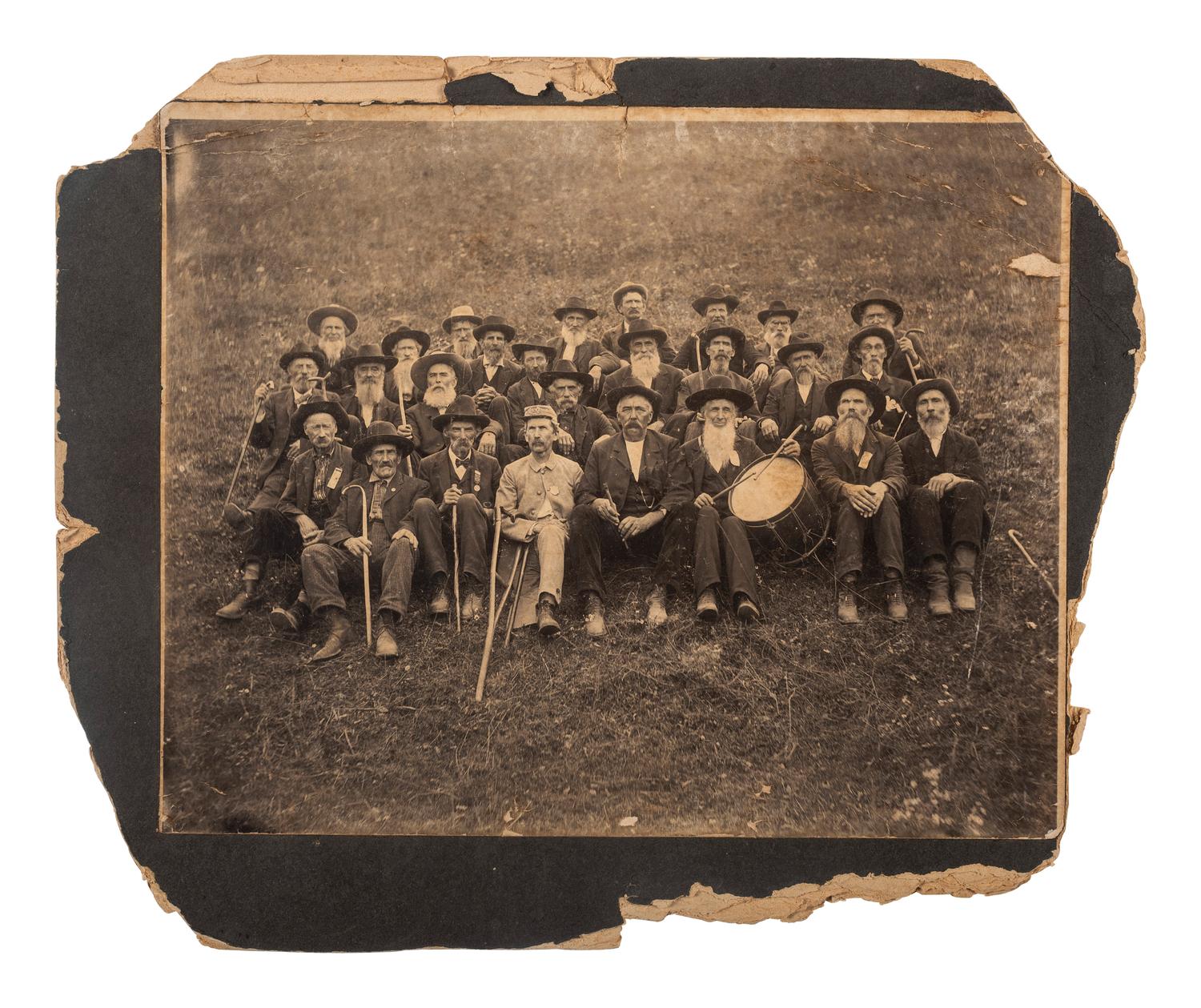[UNITED CONFEDERATE VETERANS]. Outdoor group portrait of UCV members including musicians.