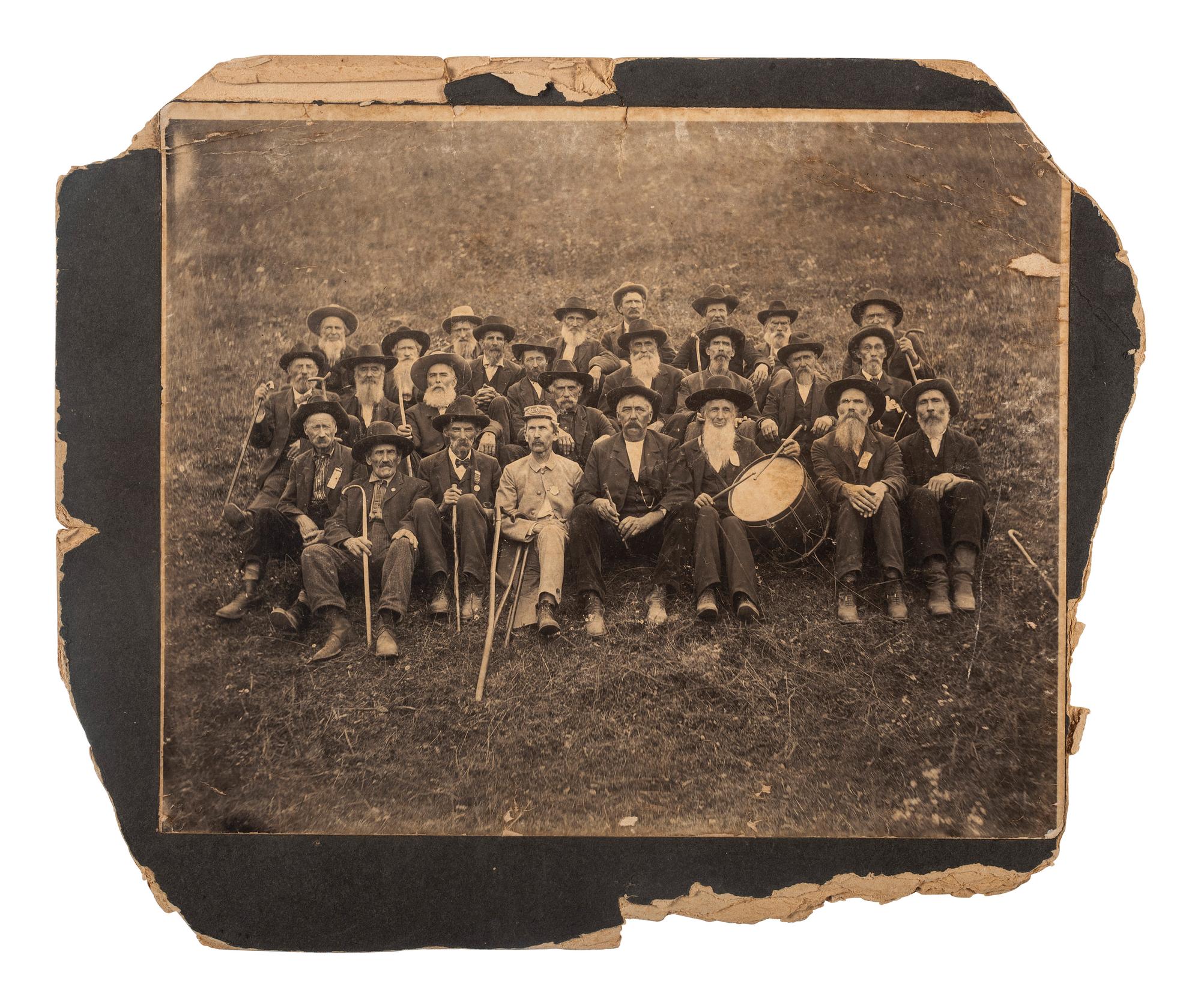 [UNITED CONFEDERATE VETERANS]. Outdoor group portrait of UCV members including musicians.