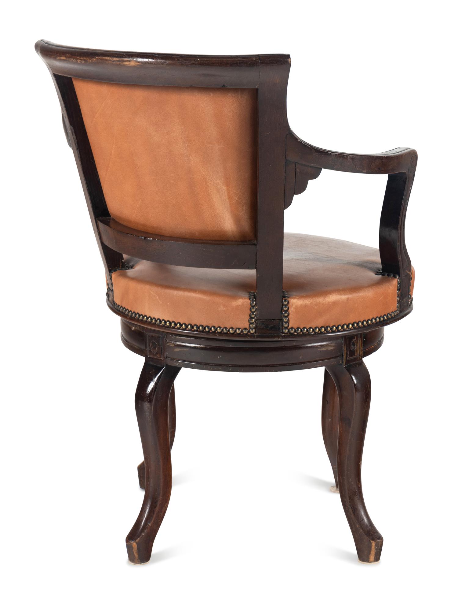 A Directoire Style Leather-Upholstered Swiveling Armchair