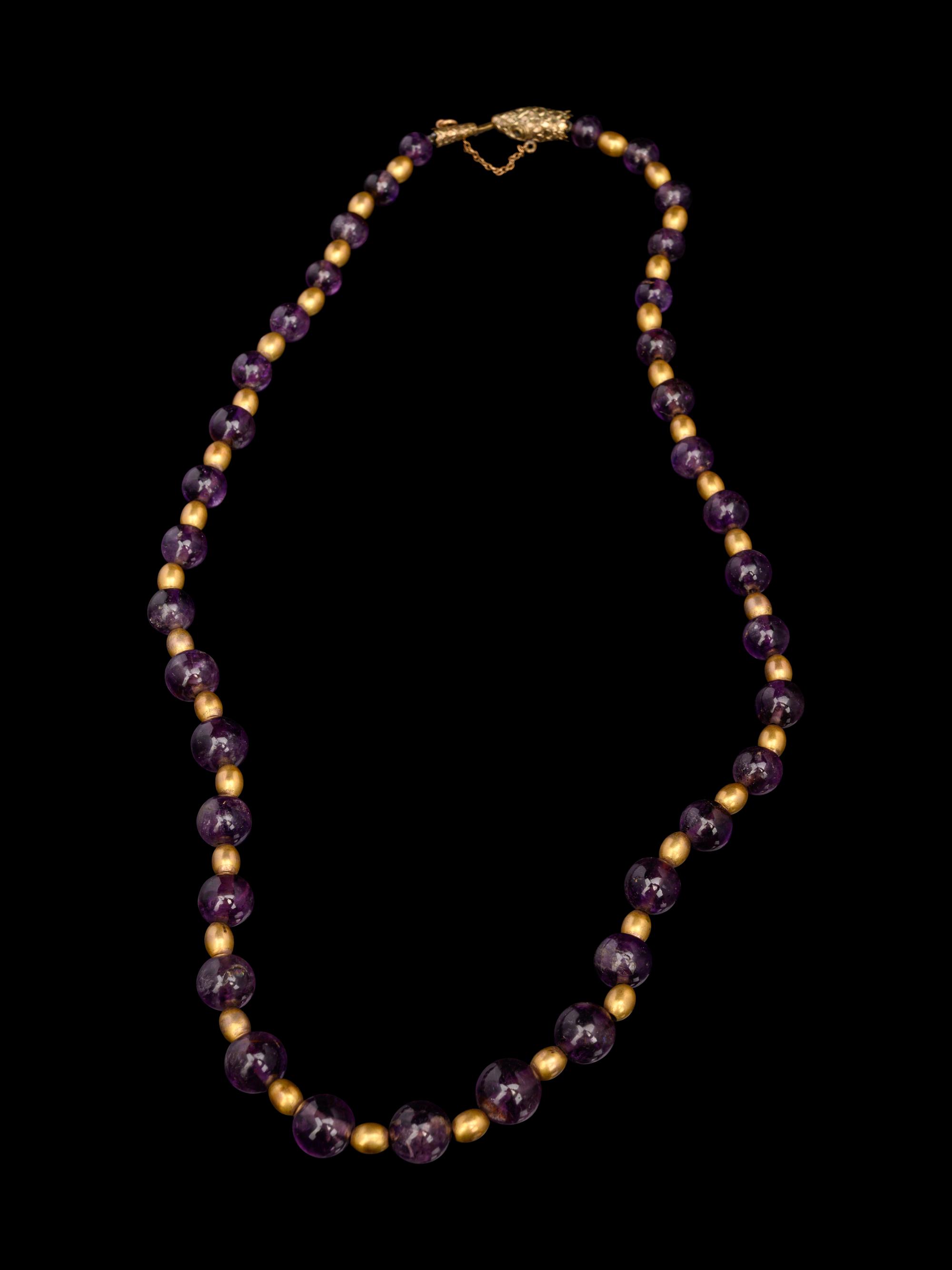 A Necklace of Amethyst and Gold Beads