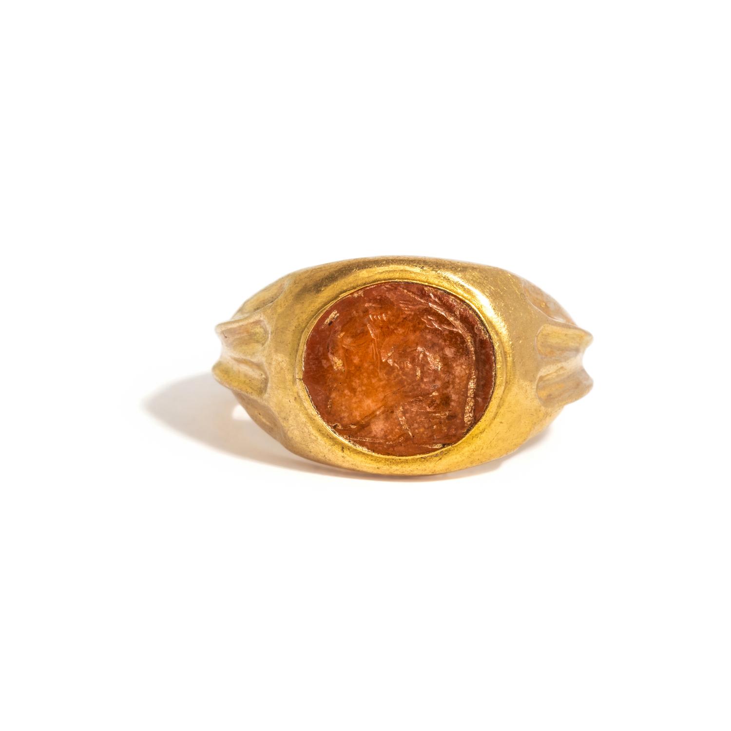 A Roman Gold and Citrine Finger Ring with Pysche and Eros
