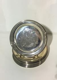 A Set of Twelve American Silver Bread Plates, Mauser Mfg. Co., New York, NY, with reeded edges.