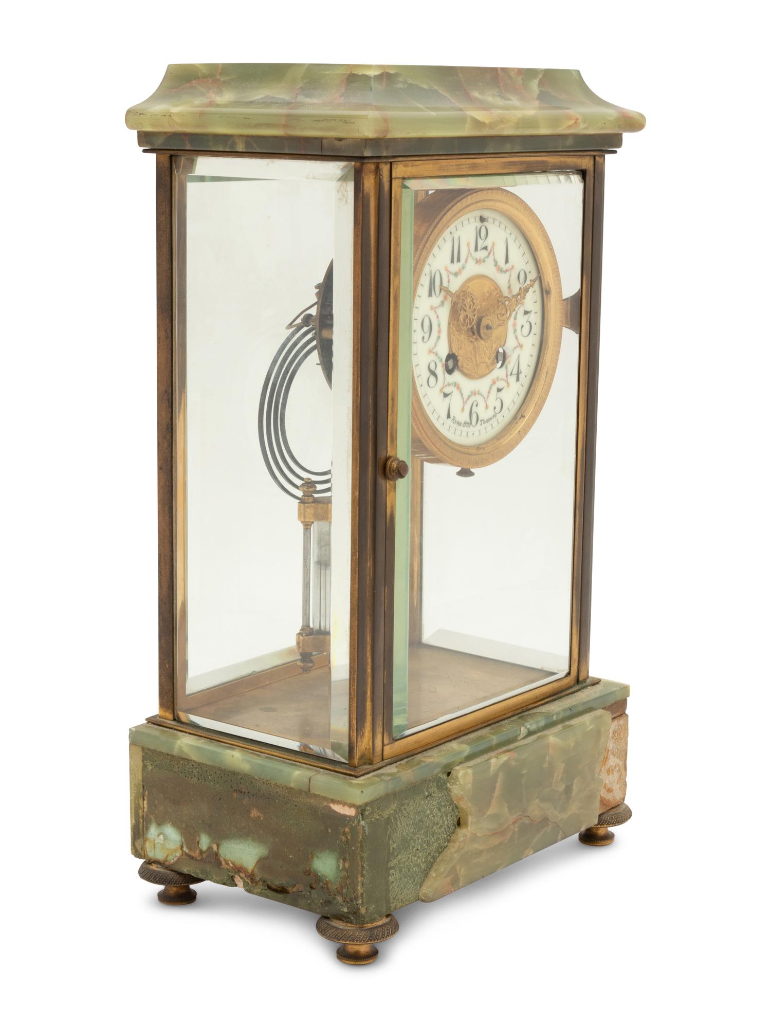 A French Parcel Gilt Bronze and Onyx Clock