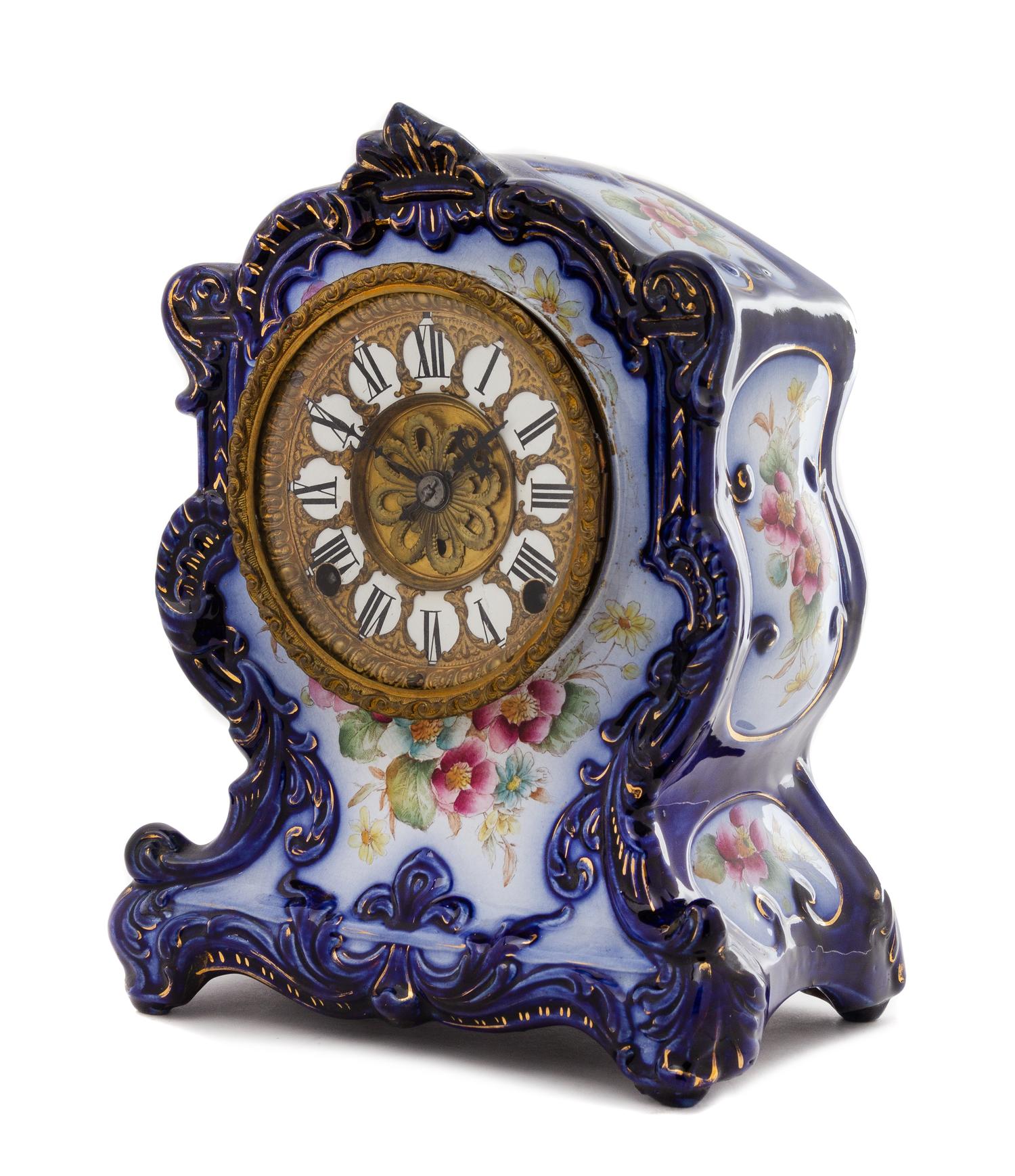 A Continental Porcelain Cased Mantel Clock