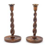 A Pair of Walnut Turned Candlesticks