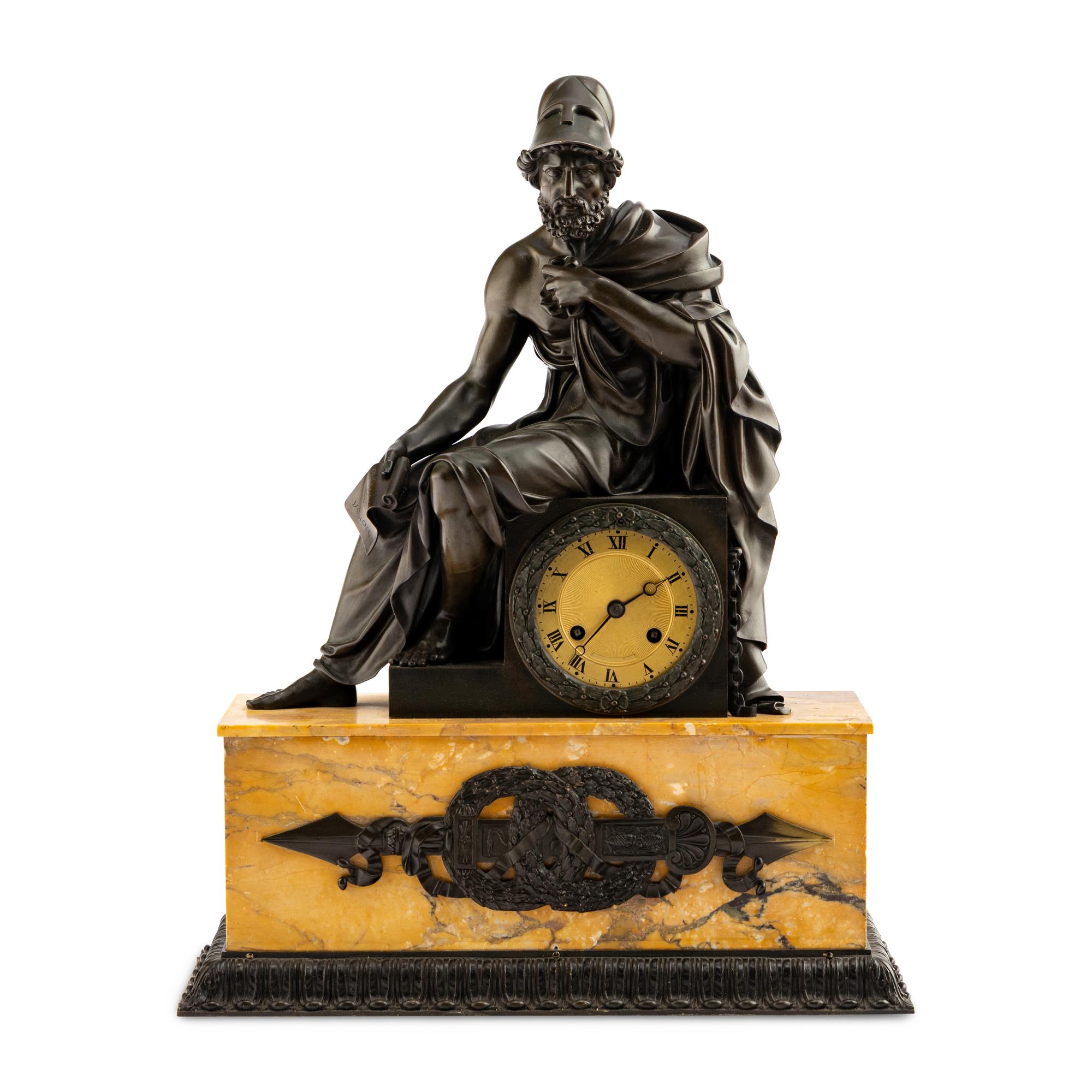 A Louis Philippe Patinated Bronze and Sienna Marble Figural Mantel Clock