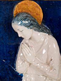 An Italian Glazed Earthenware Plaque of the Madonna and Child