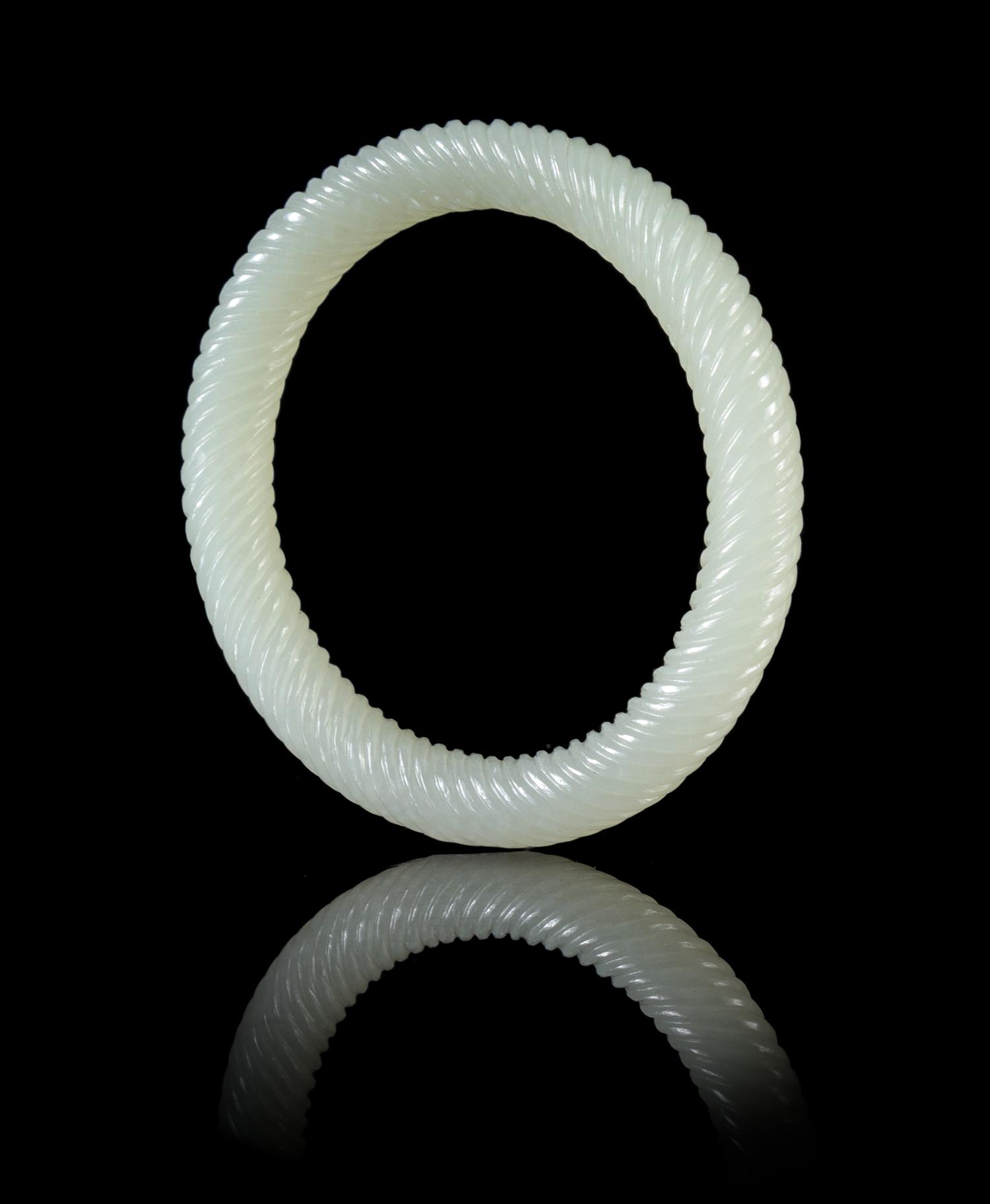 A Pale Celadon Jade Spiral Twist Bangle Diameter 3 inches.