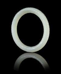 A Pale Celadon Jade Spiral Twist Bangle Diameter 3 inches.