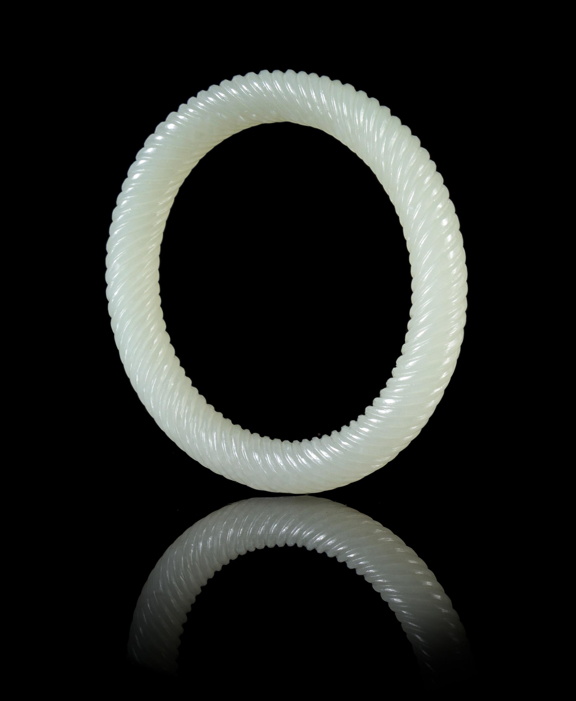 A Pale Celadon Jade Spiral Twist Bangle Diameter 3 inches.
