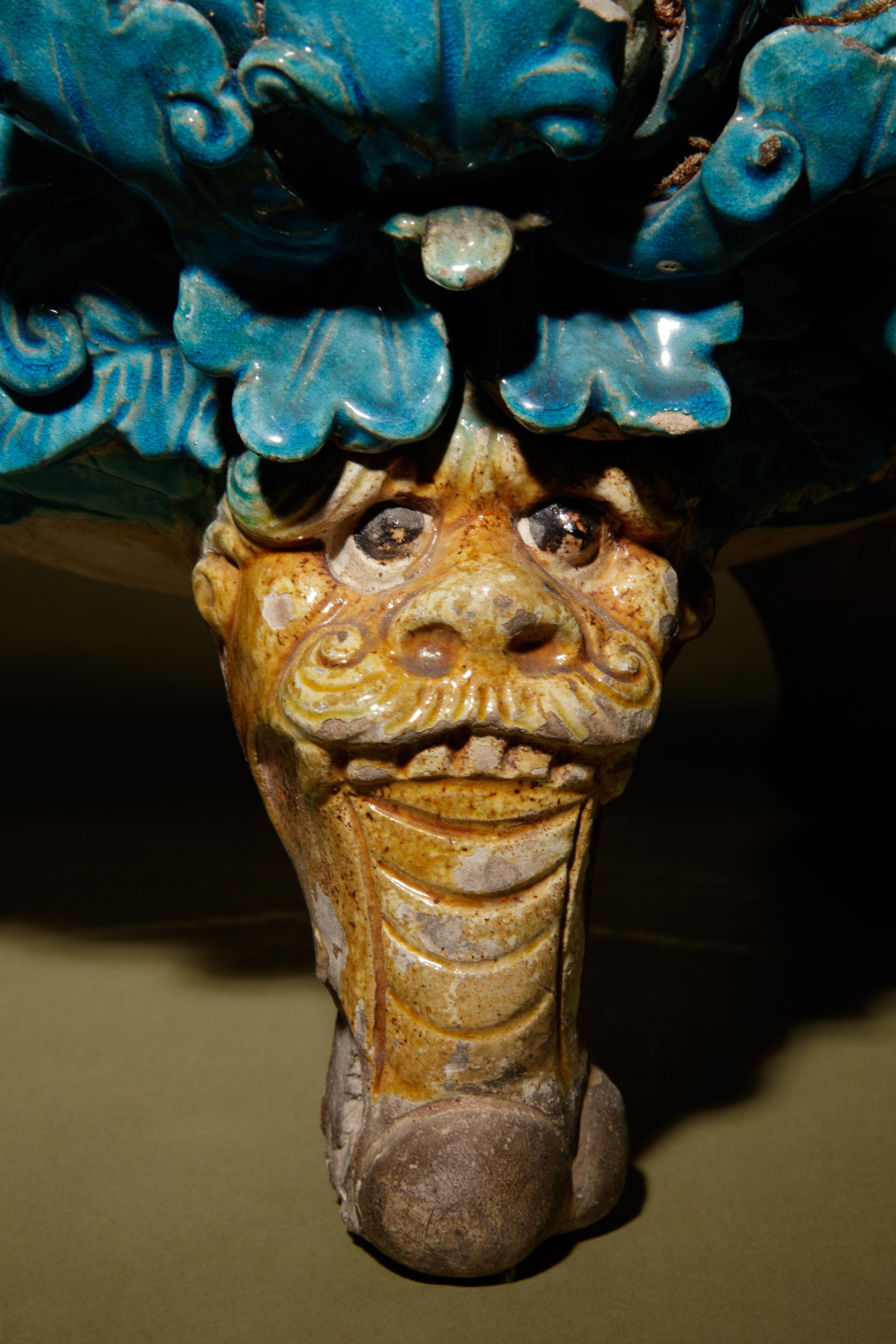 A Turquoise and Ochre Glazed Tileworks Tripod Incense Burner