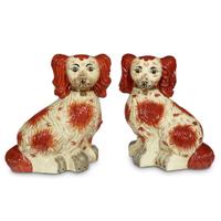 A monumental pair of Staffordshire style spaniels 20th century