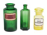 A Group of Green Glass Apothecary Bottles