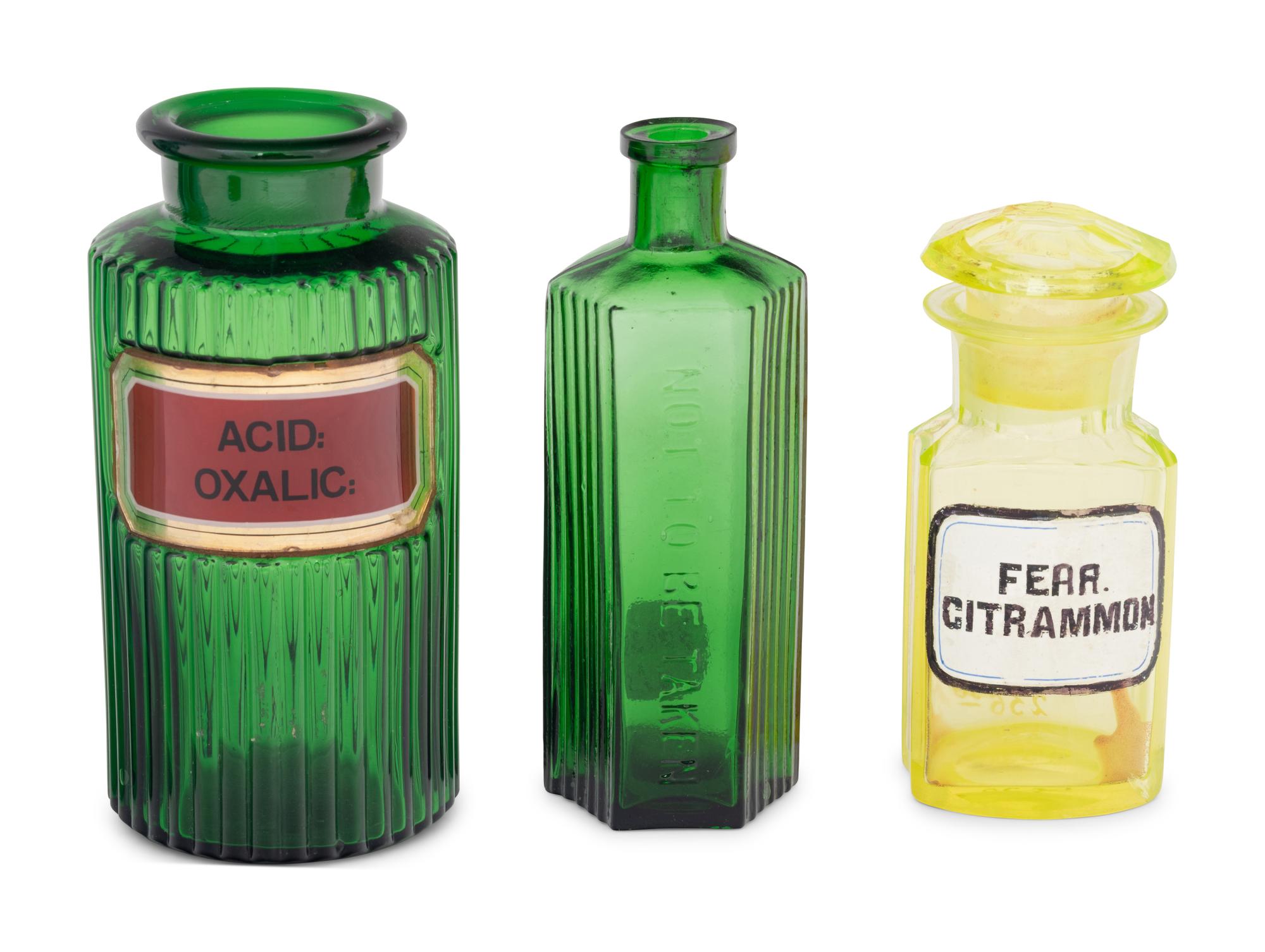 A Group of Green Glass Apothecary Bottles