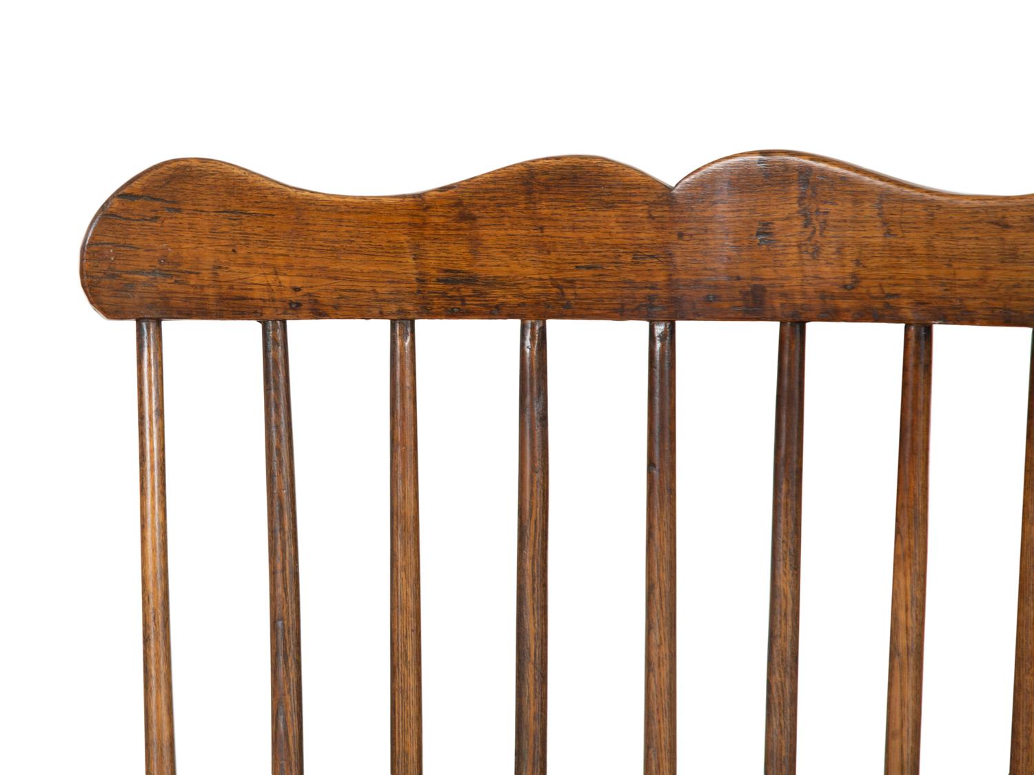A George III Oak Comb-Back Windsor Armchair