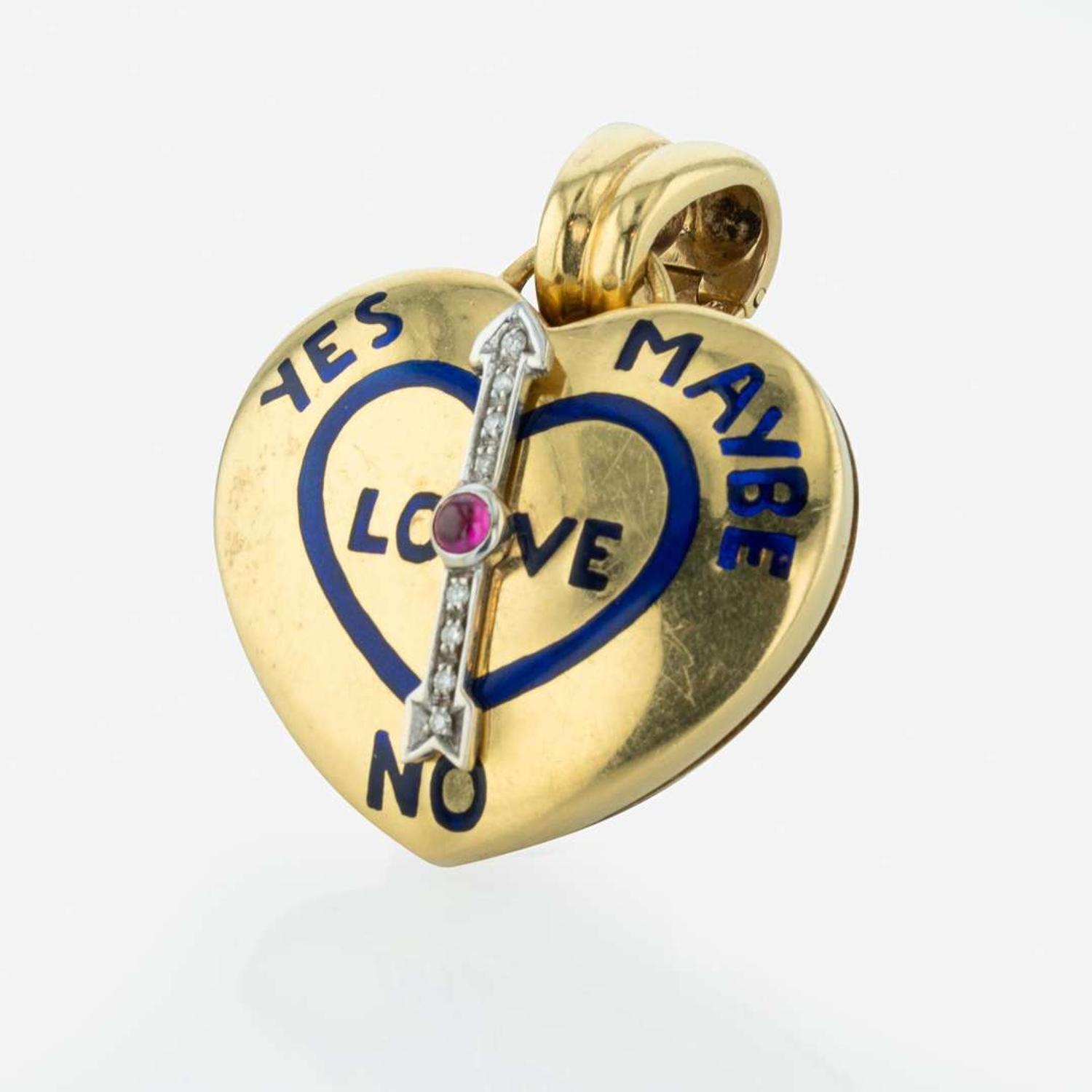 An 18K Yellow Gold, Diamond, and Ruby Heart Shape Pendant