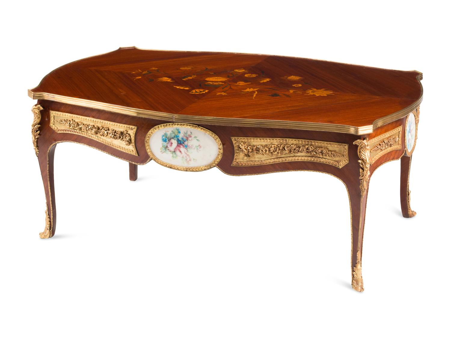 A Louis XV Style Gilt Bronze and Porcelain Mounted Low Table