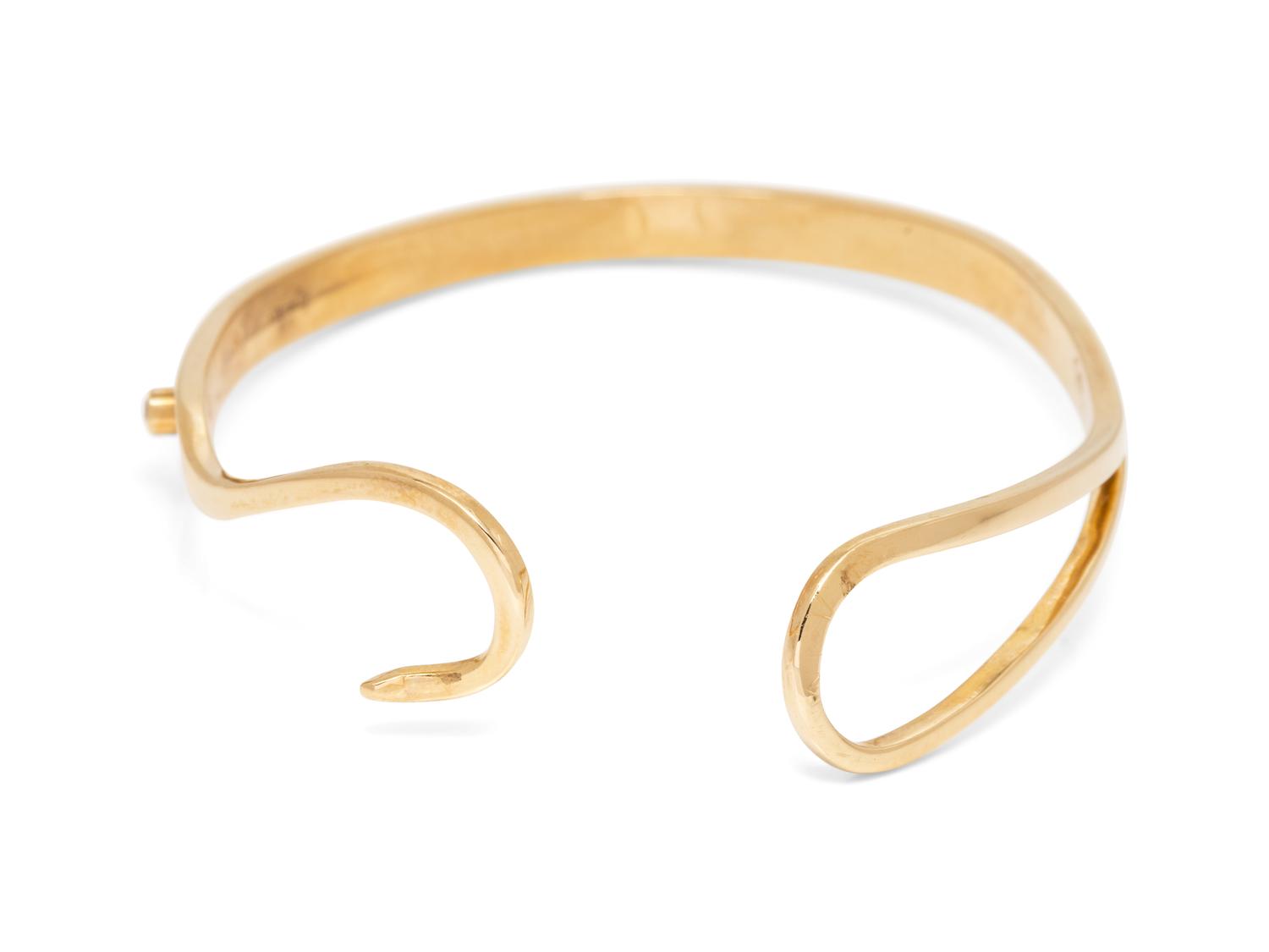 A 14 Karat Yellow Gold and Ruby Bangle Bracelet,