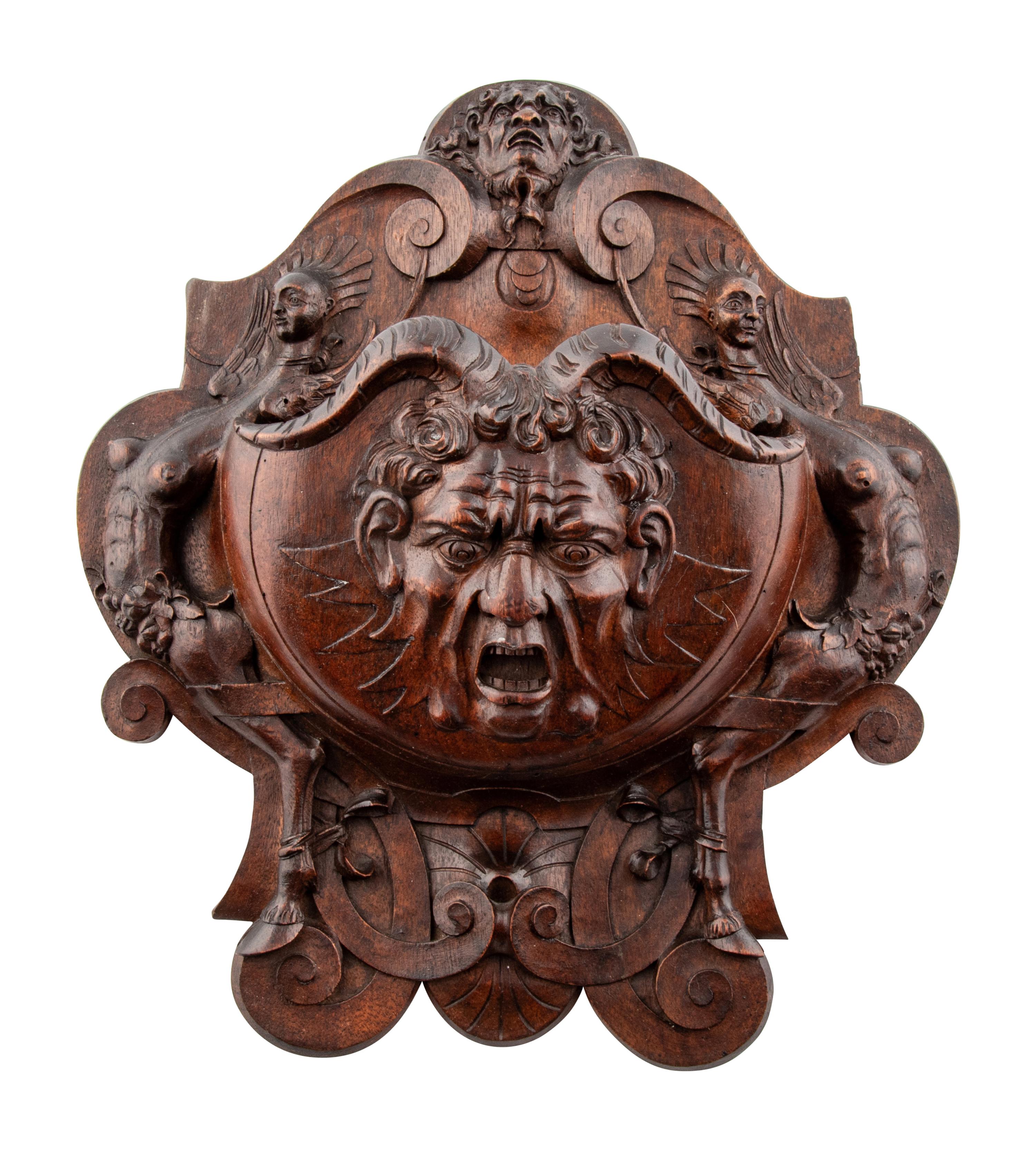 An Italian Carved Walnut Wall Pocket