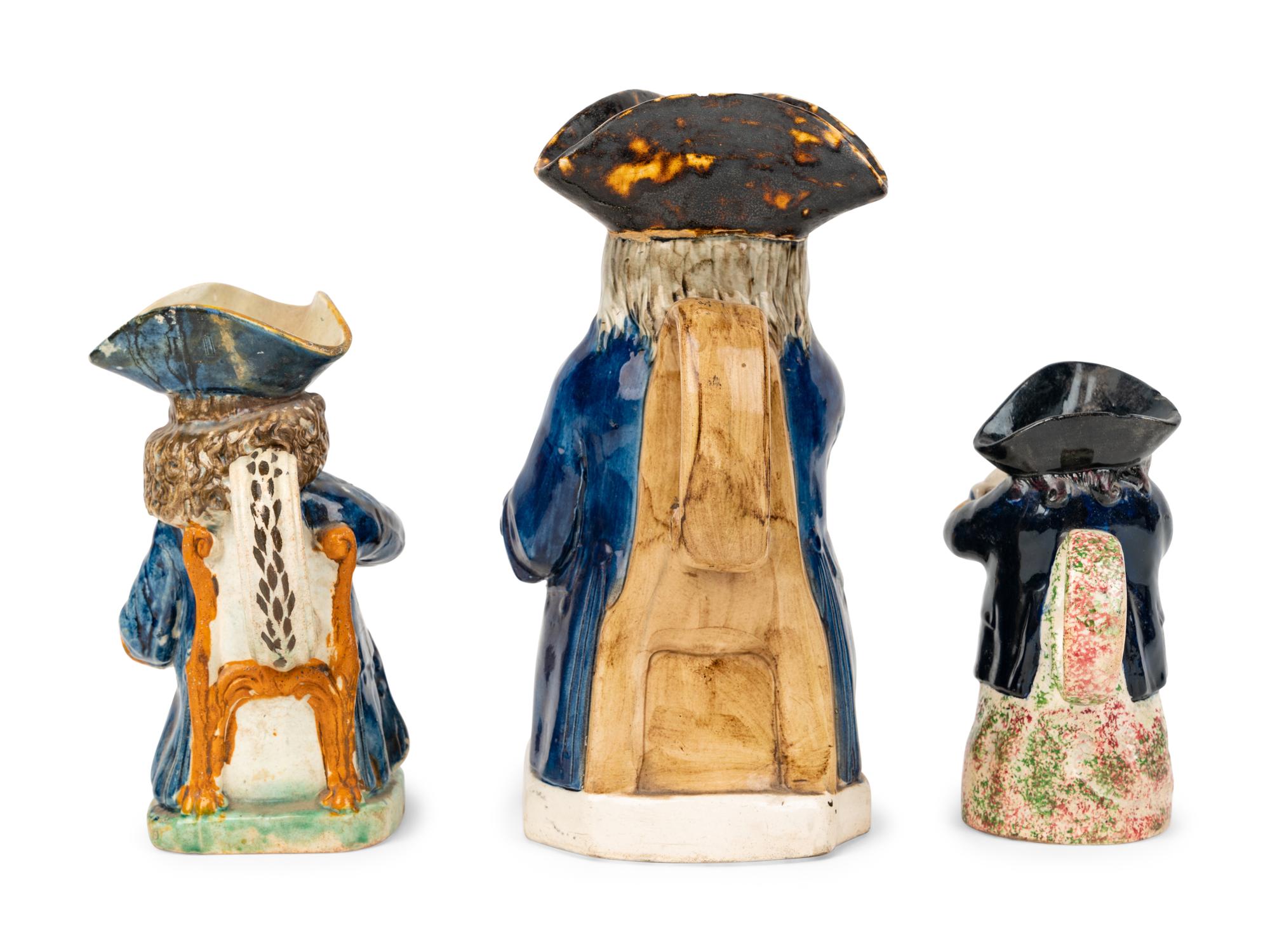A Dr. Johnson Toby Jug and Two Other Toby Jugs