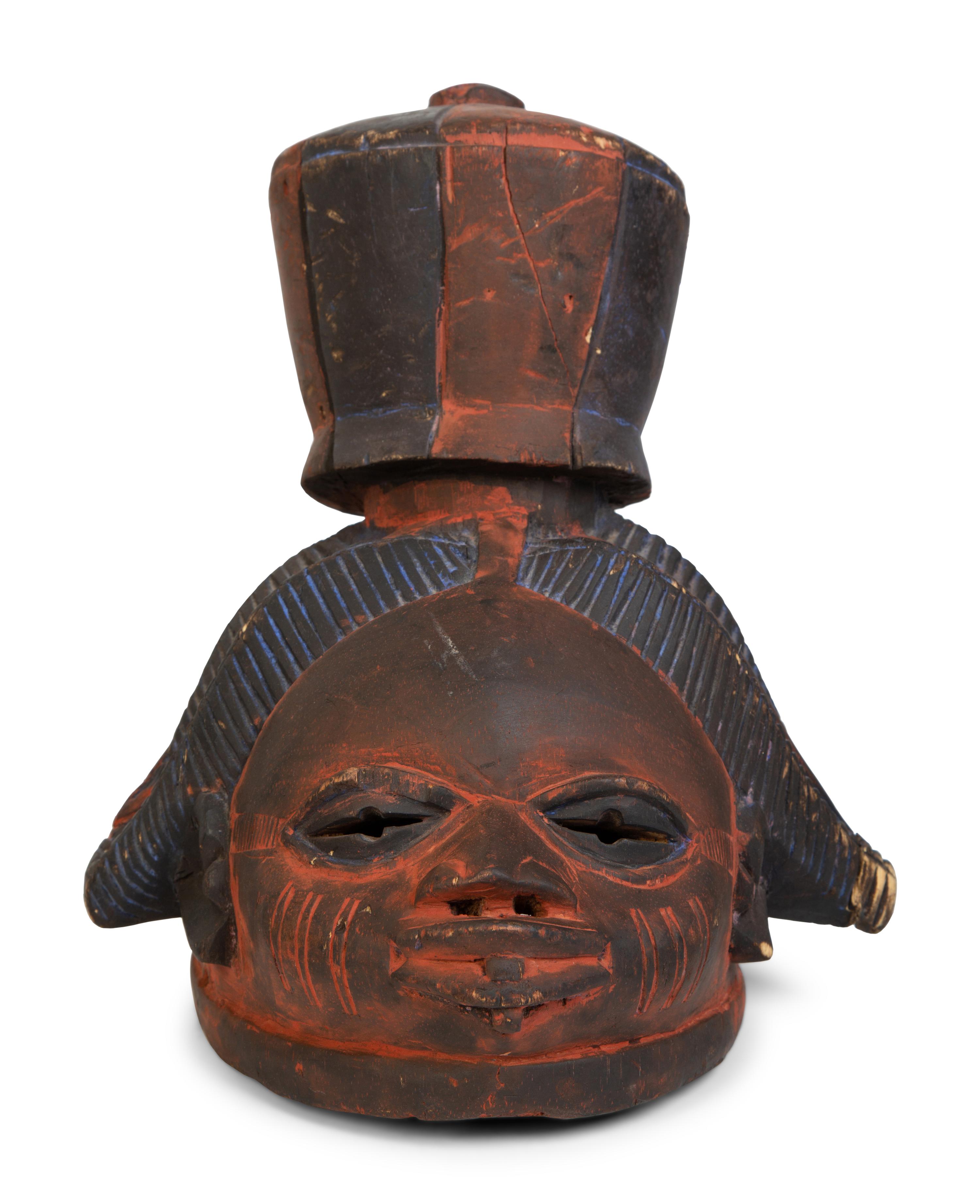 A Group of Three Helmet Masks from Tribes of West Africa — 20TH CENTURY