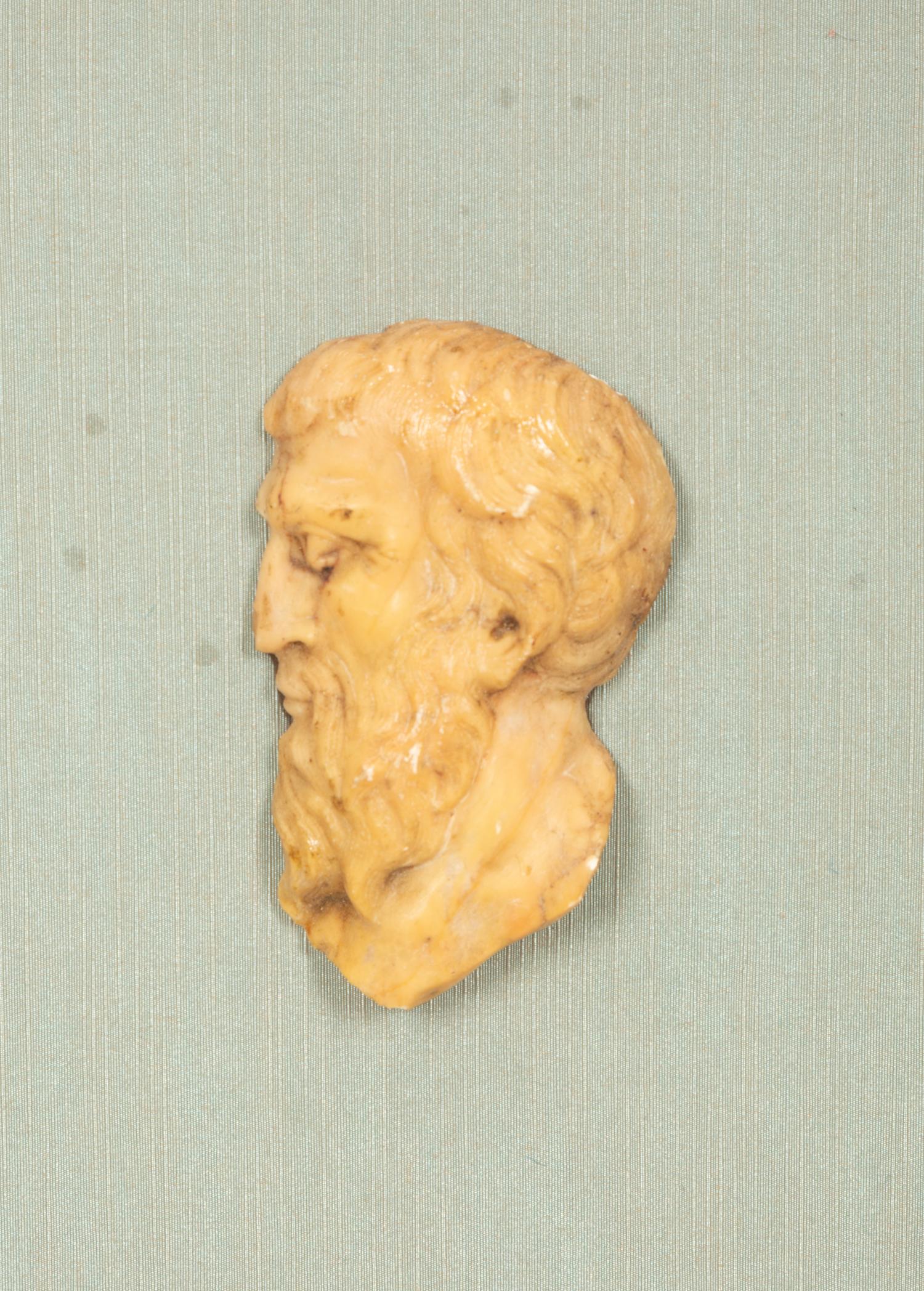 A Pair of Continental Faux Tortoiseshell Painted Framed Composition Plaques of Profile Busts