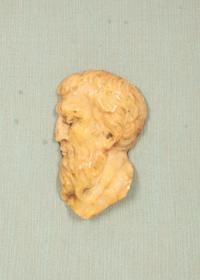 A Pair of Continental Faux Tortoiseshell Painted Framed Composition Plaques of Profile Busts