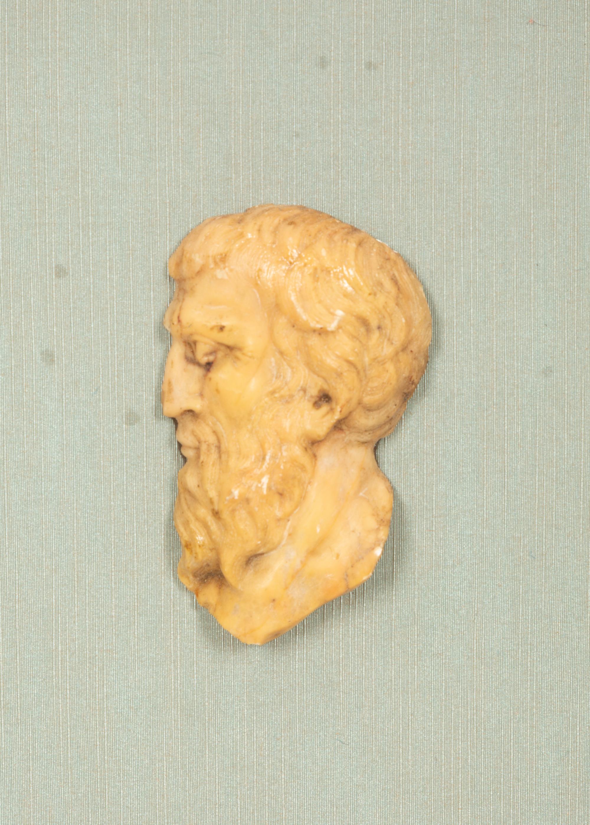A Pair of Continental Faux Tortoiseshell Painted Framed Composition Plaques of Profile Busts