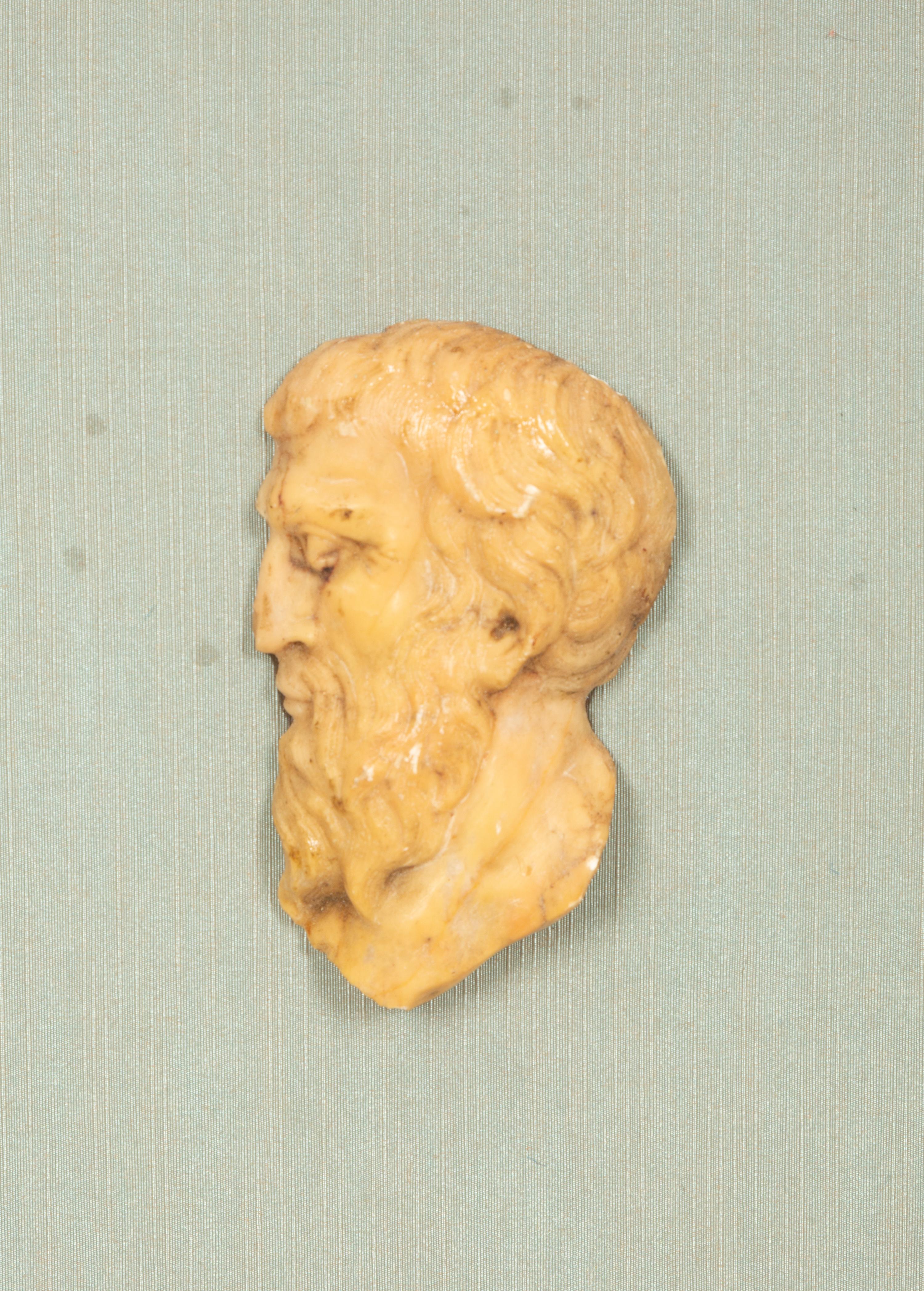 A Pair of Continental Faux Tortoiseshell Painted Framed Composition Plaques of Profile Busts