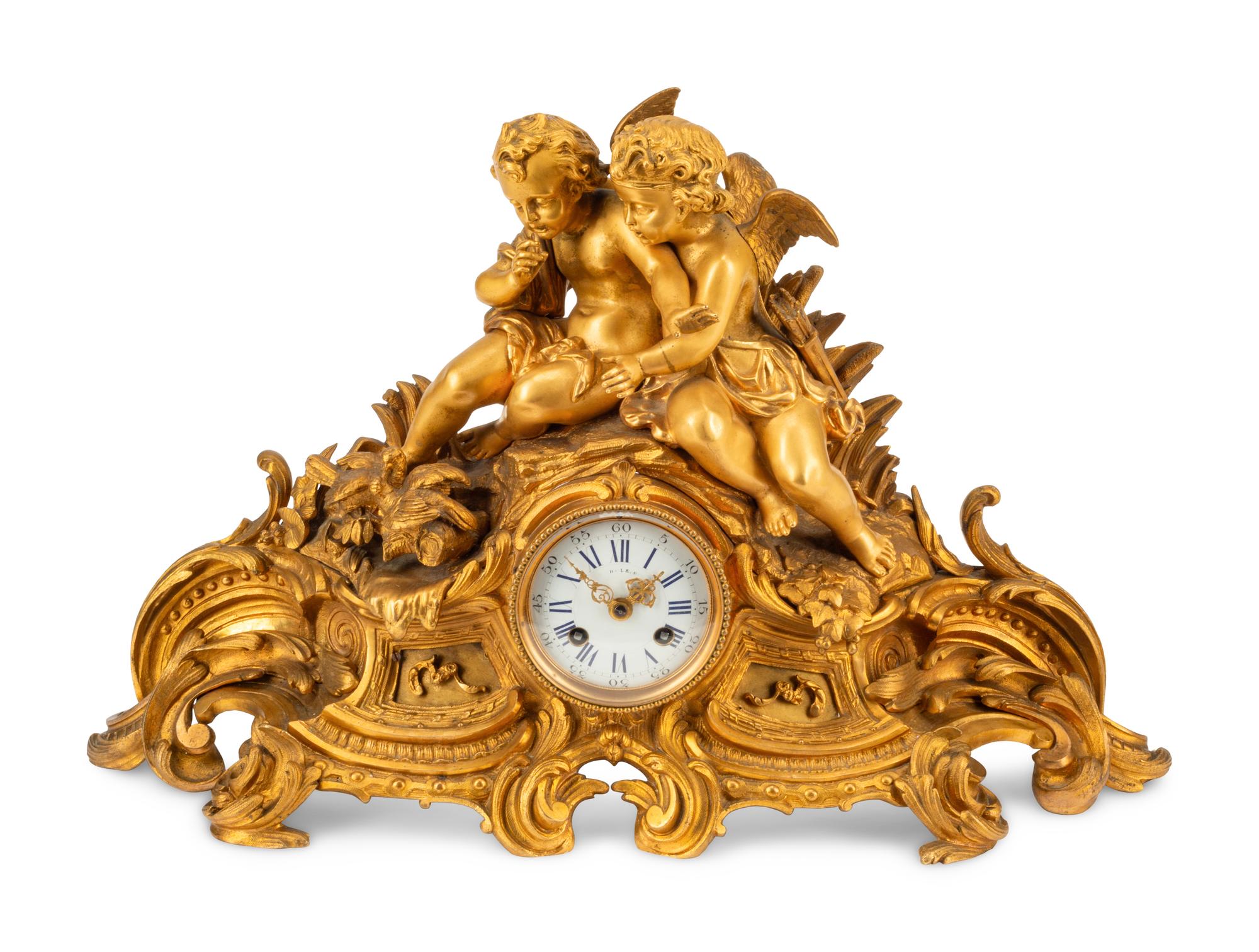 A French Gilt Bronze Figural Mantel Clock