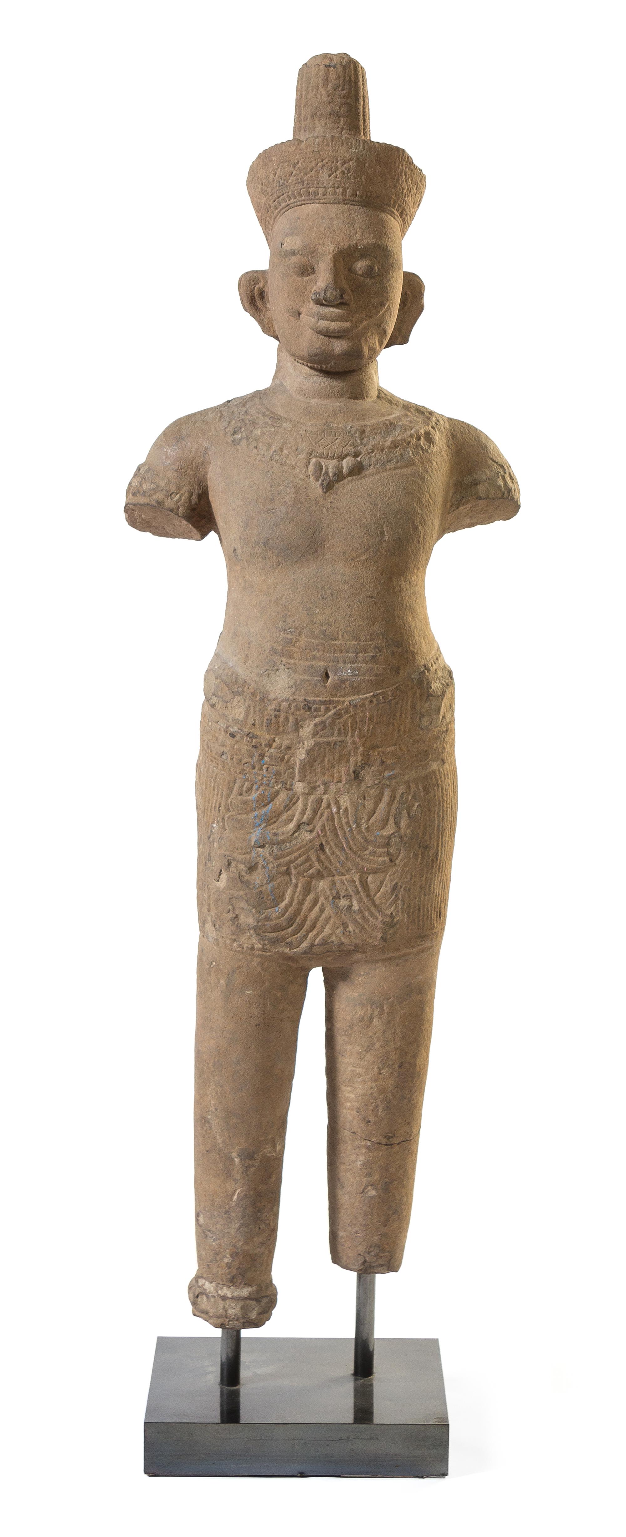 A Khmer Sandstone Figure of a Male Deity Height of figure 58 3/4 inches. — POSSIBLY 10TH-12TH CENTURY