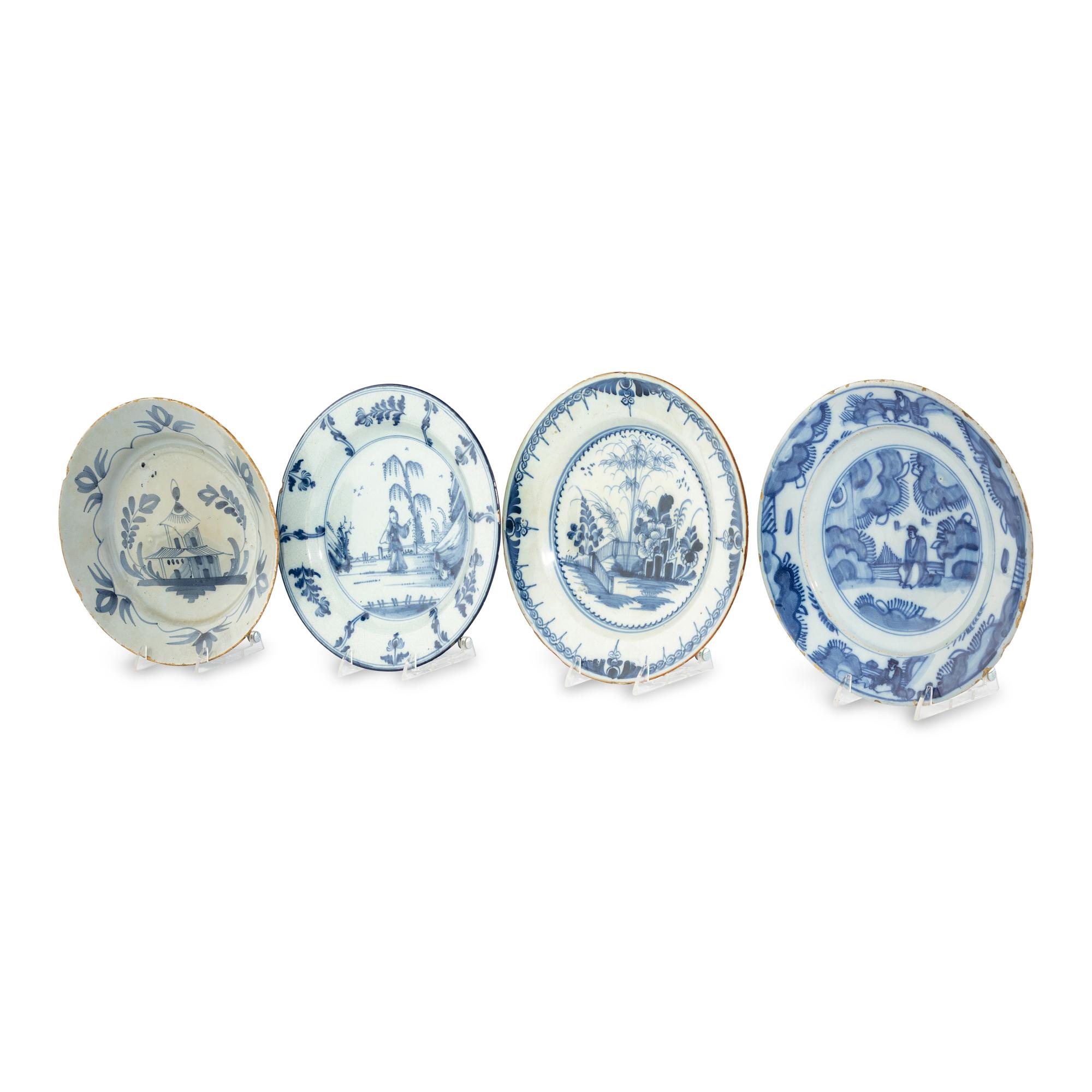 A Collection of Four Delft Blue and White Plates