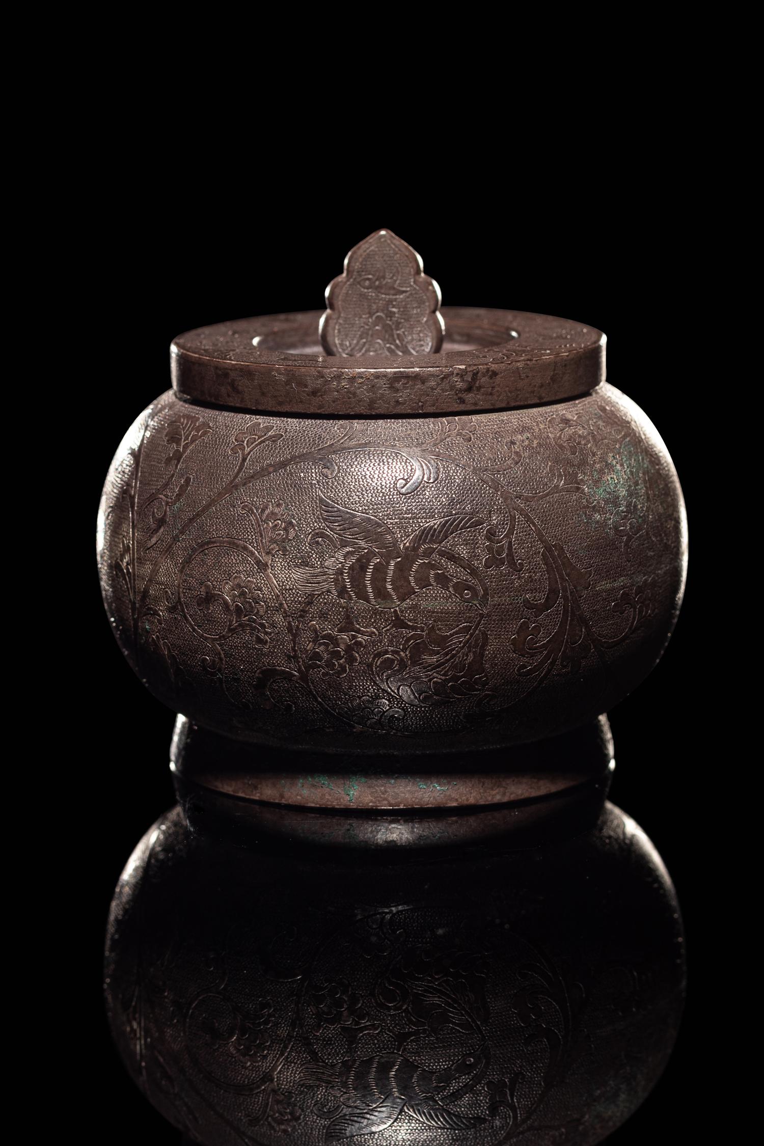 An Incised Silver Covered Jar