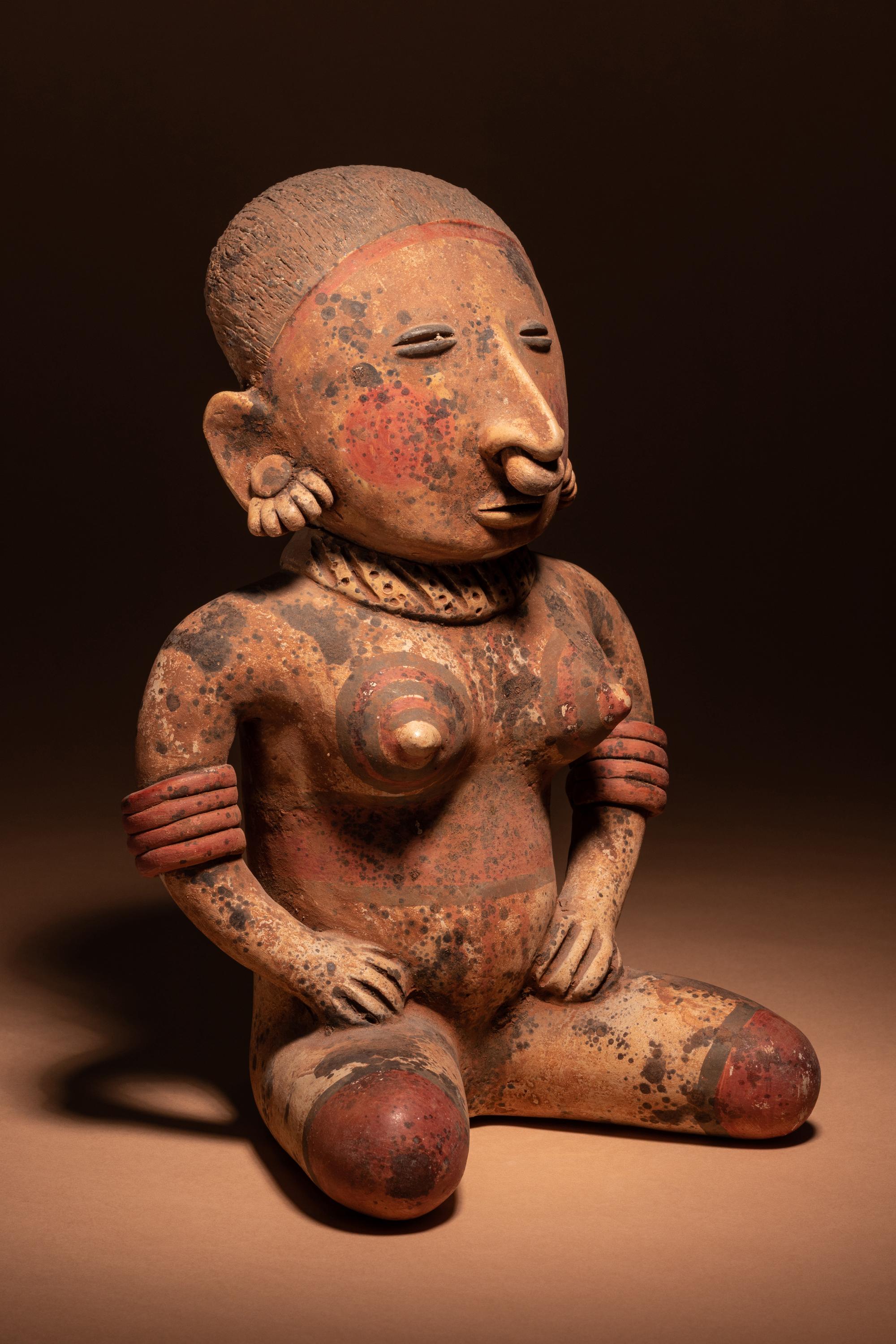A Nayarit Terracotta Seated Female Figure