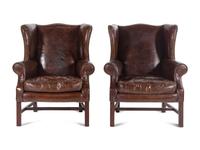 A Pair of Georgian Style Leather Upholstered Wingback Armchairs